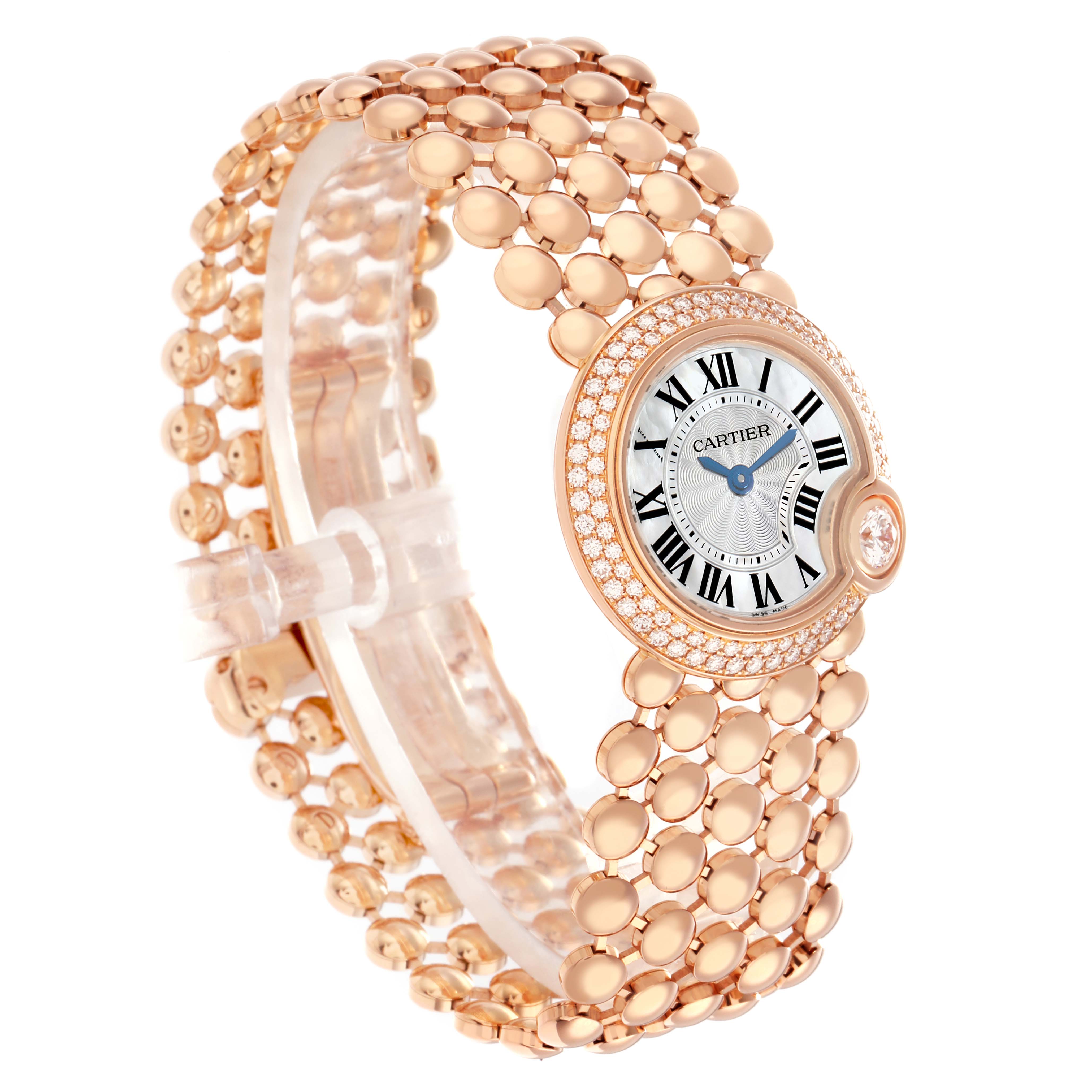 The Cartier Ballon Blanc WE902057 Women
s Rose Gold Mother of Pearl Dial watch is shown from an angled side view, highlighting its round face, diamond bezel, and bracelet detail.