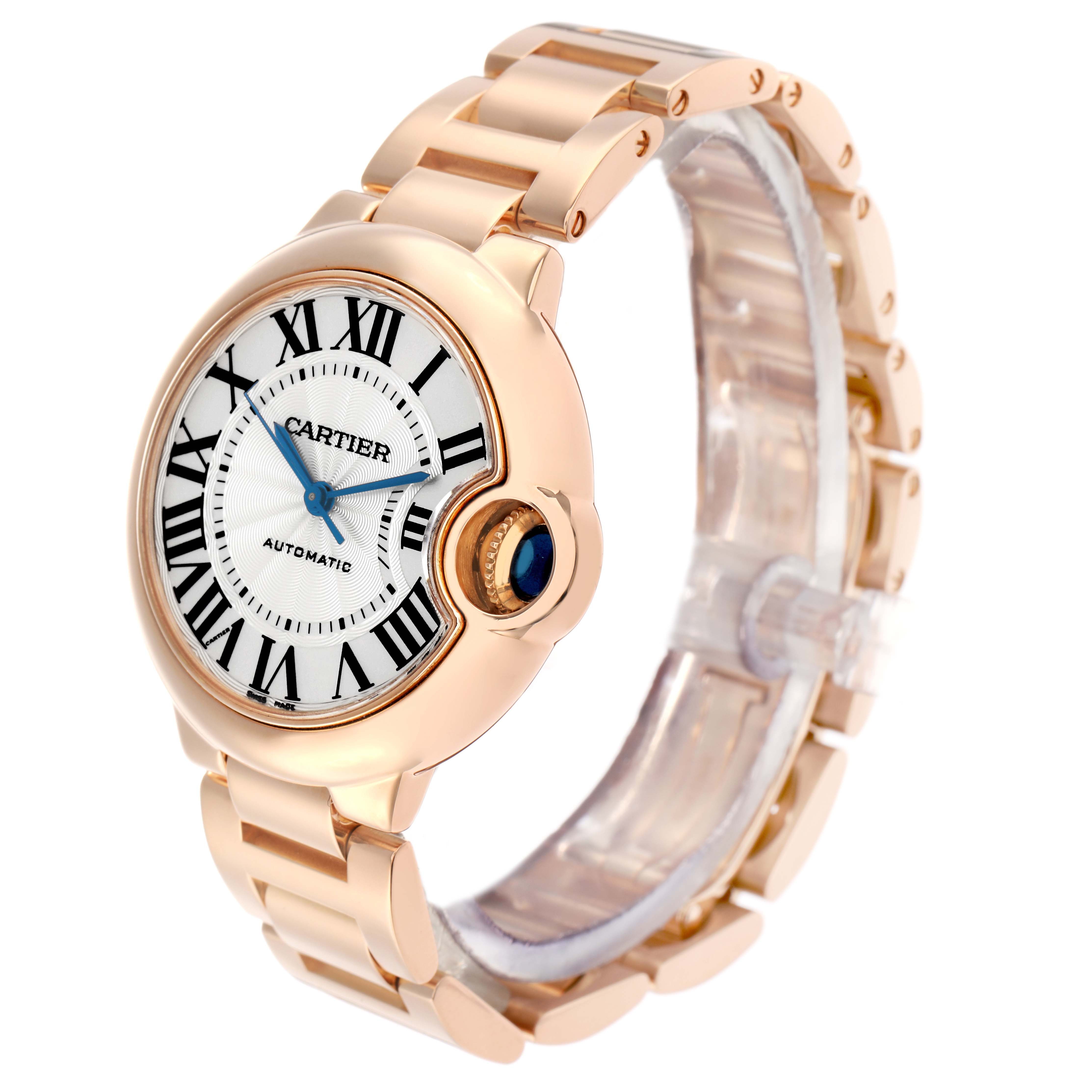 The Cartier Ballon Bleu W6920096 Women
s Rose Gold Silver Dial watch is shown from a front angle, featuring its face, crown with a blue cabochon, and bracelet.
