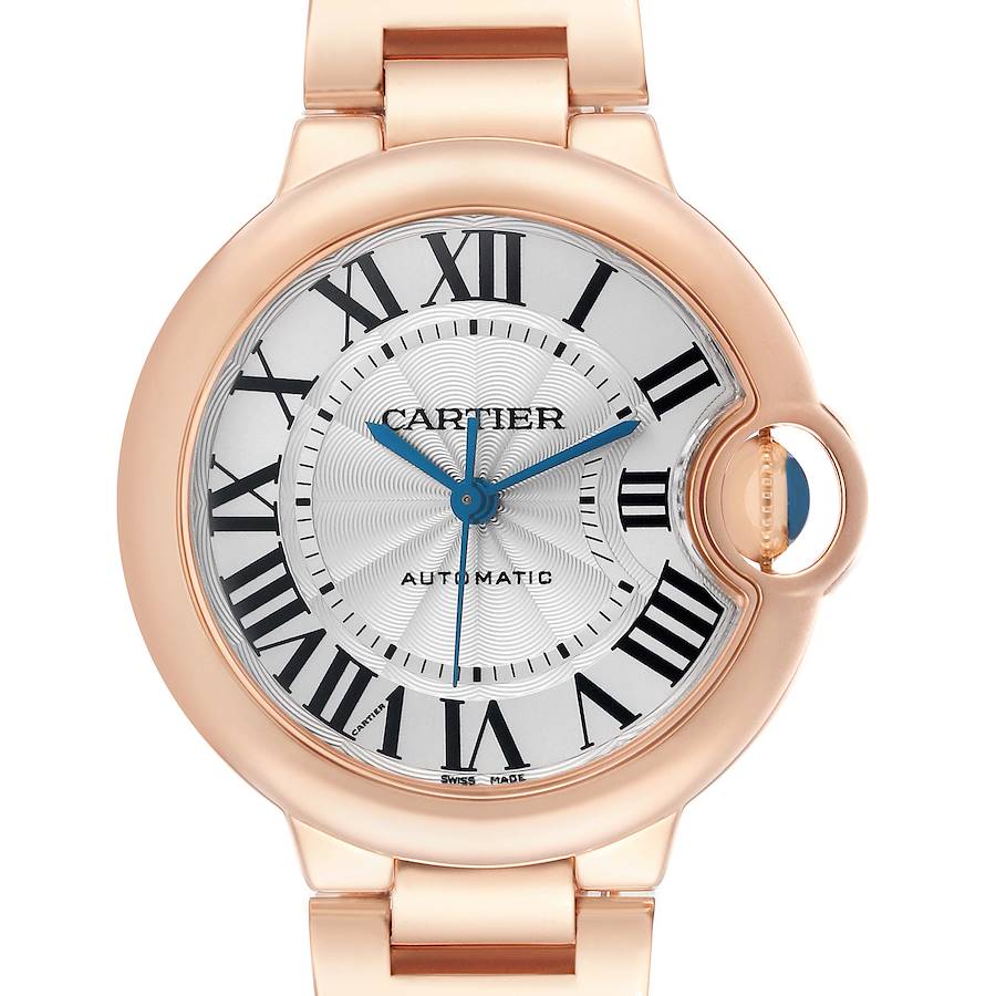 The Cartier Ballon Bleu W6920096 Women's Rose Gold Silver Dial watch is shown from the front, highlighting its round face, Roman numerals, and blue hands with a gold case and link.