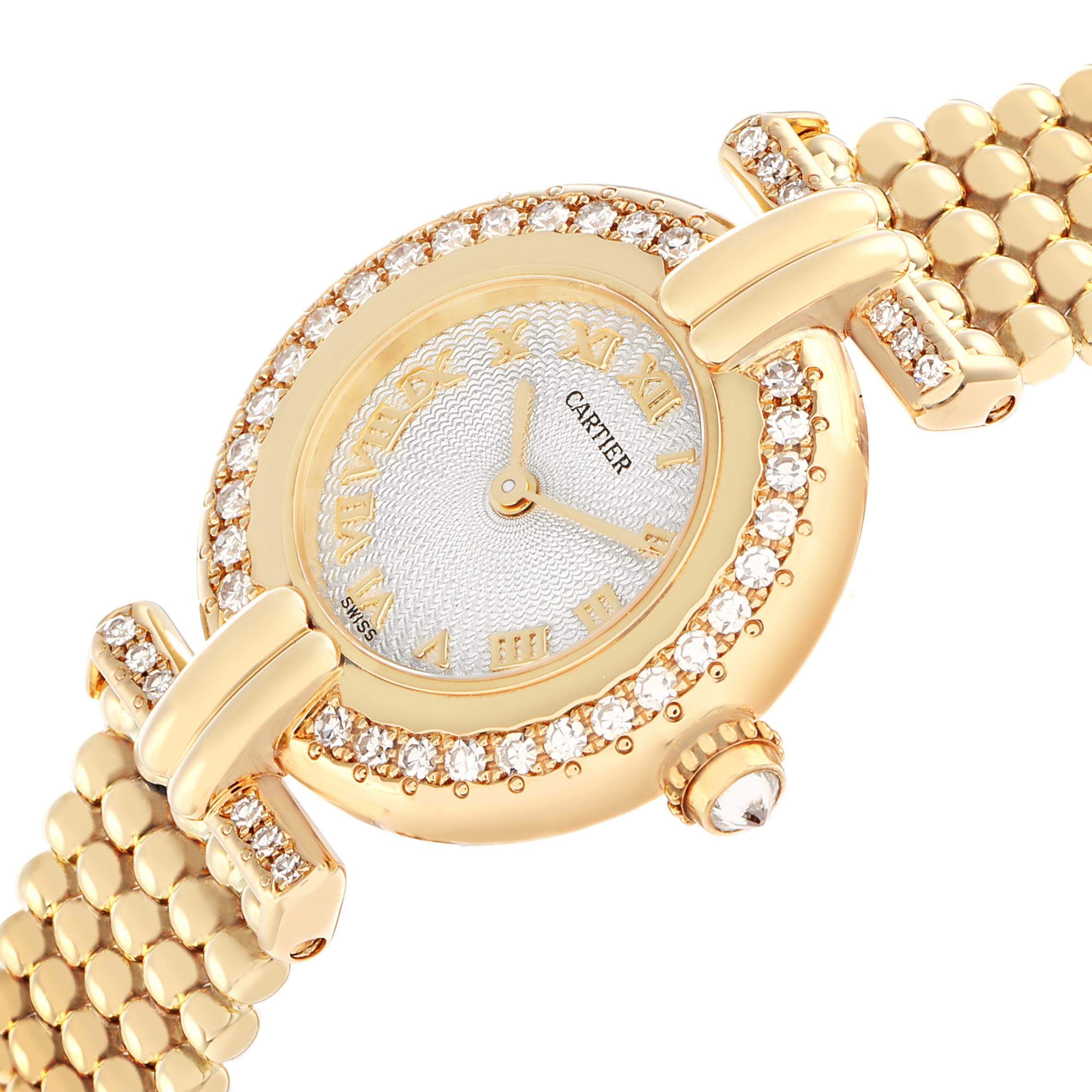 The Cartier Colisee WB1018A8 Women
s Yellow Gold Silver Dial watch is shown at an angled close-up, highlighting the diamond-studded bezel, face, and bracelet links.