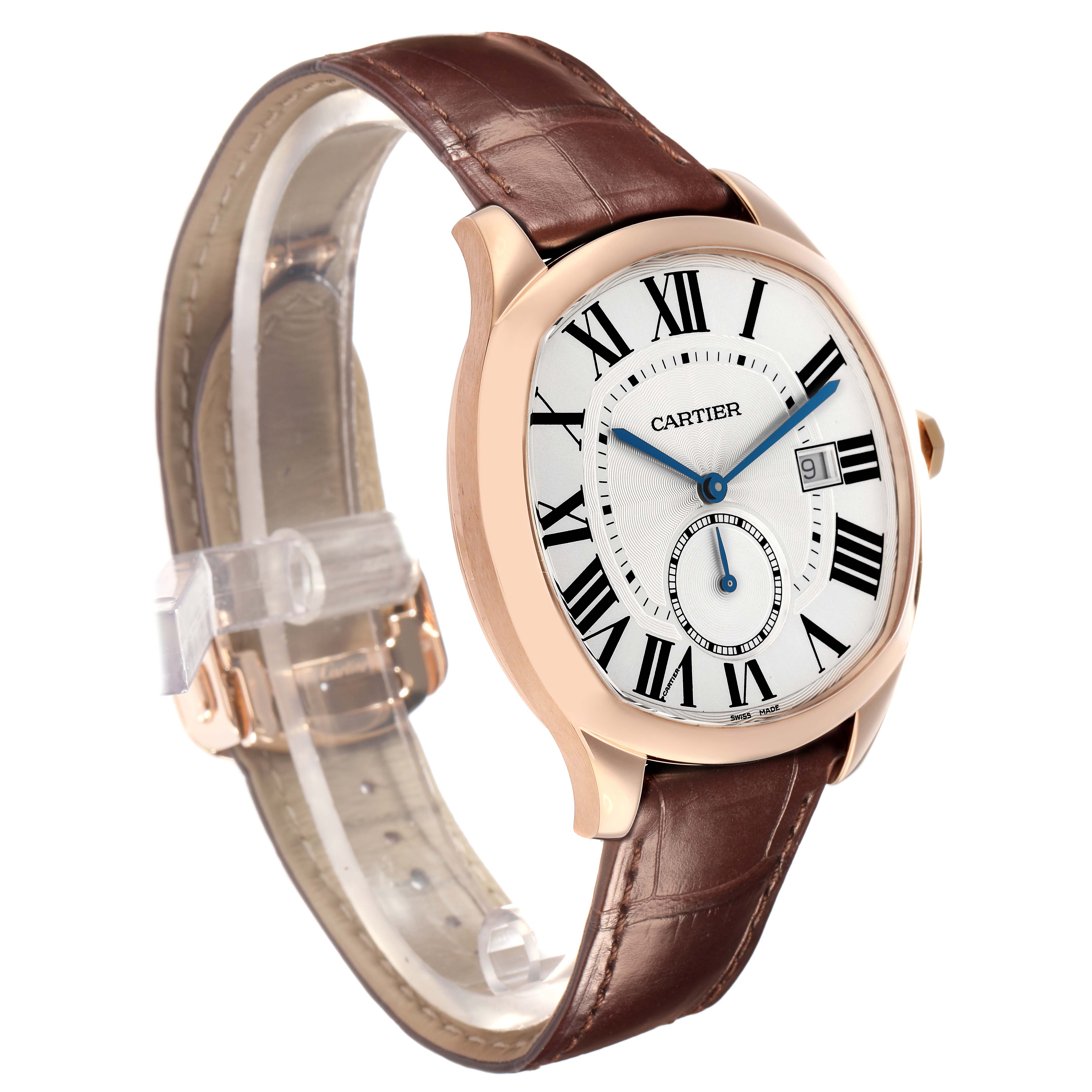 The Calibre de Cartier watch is shown at an oblique angle, highlighting the face, strap, and side of the case.