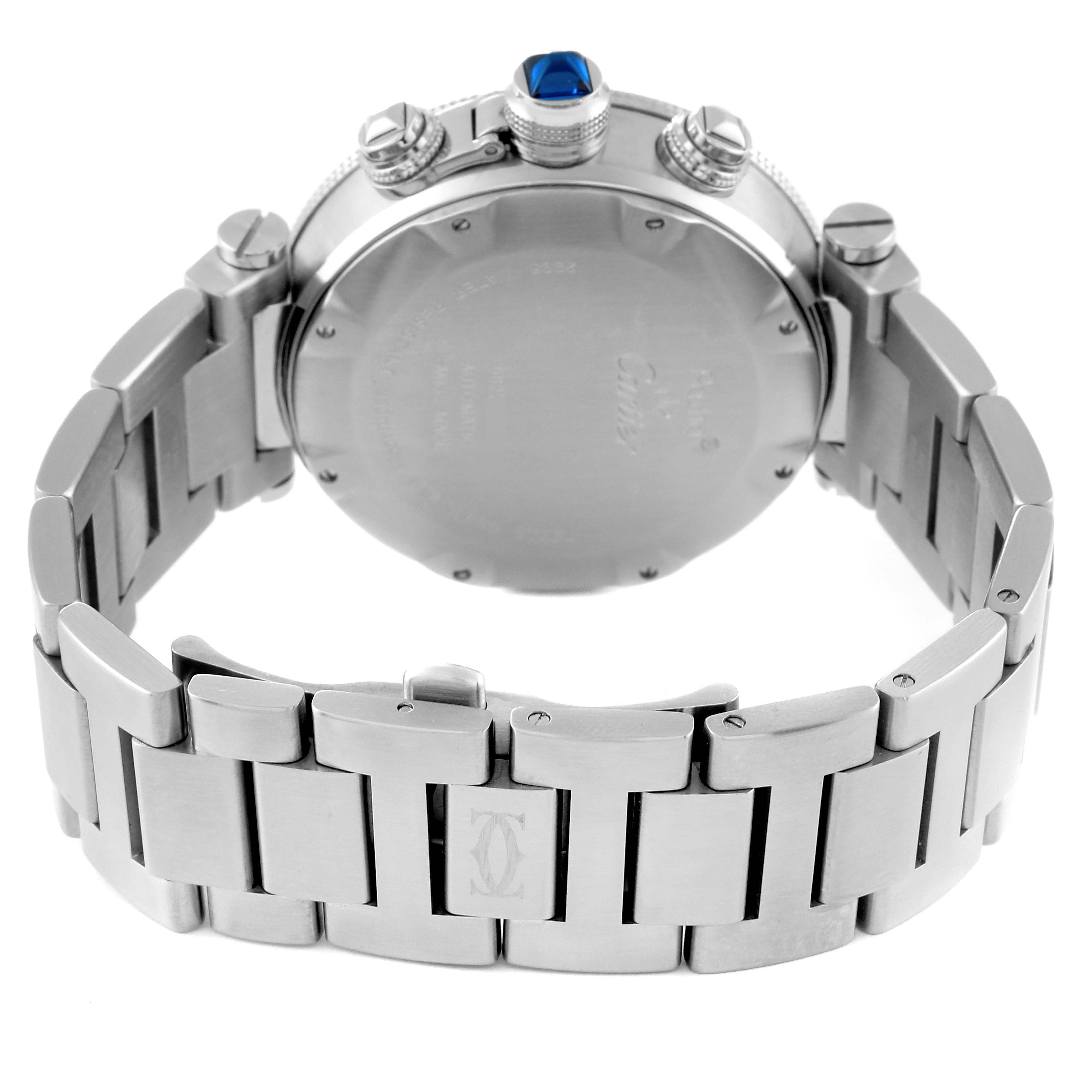 This image shows the back side of the Pasha model by Cartier, highlighting the bracelet and the crown with a blue gemstone.