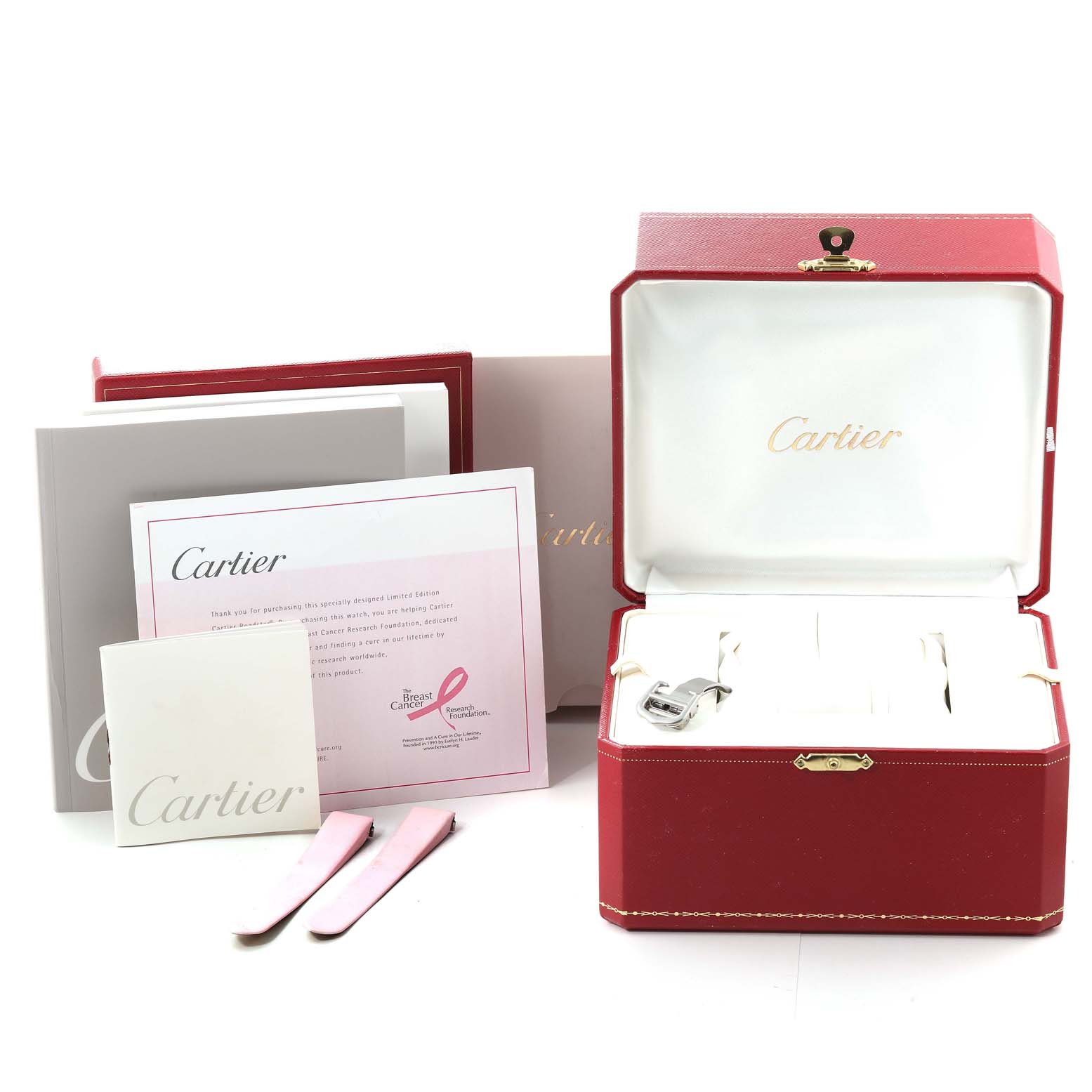 The image shows a red Cartier Roadster W62043V3 Women's Stainless Steel Pink Dial W62043V3 Women's Stainless Steel Pink Dial watch box, manuals, and additional accessories including straps.