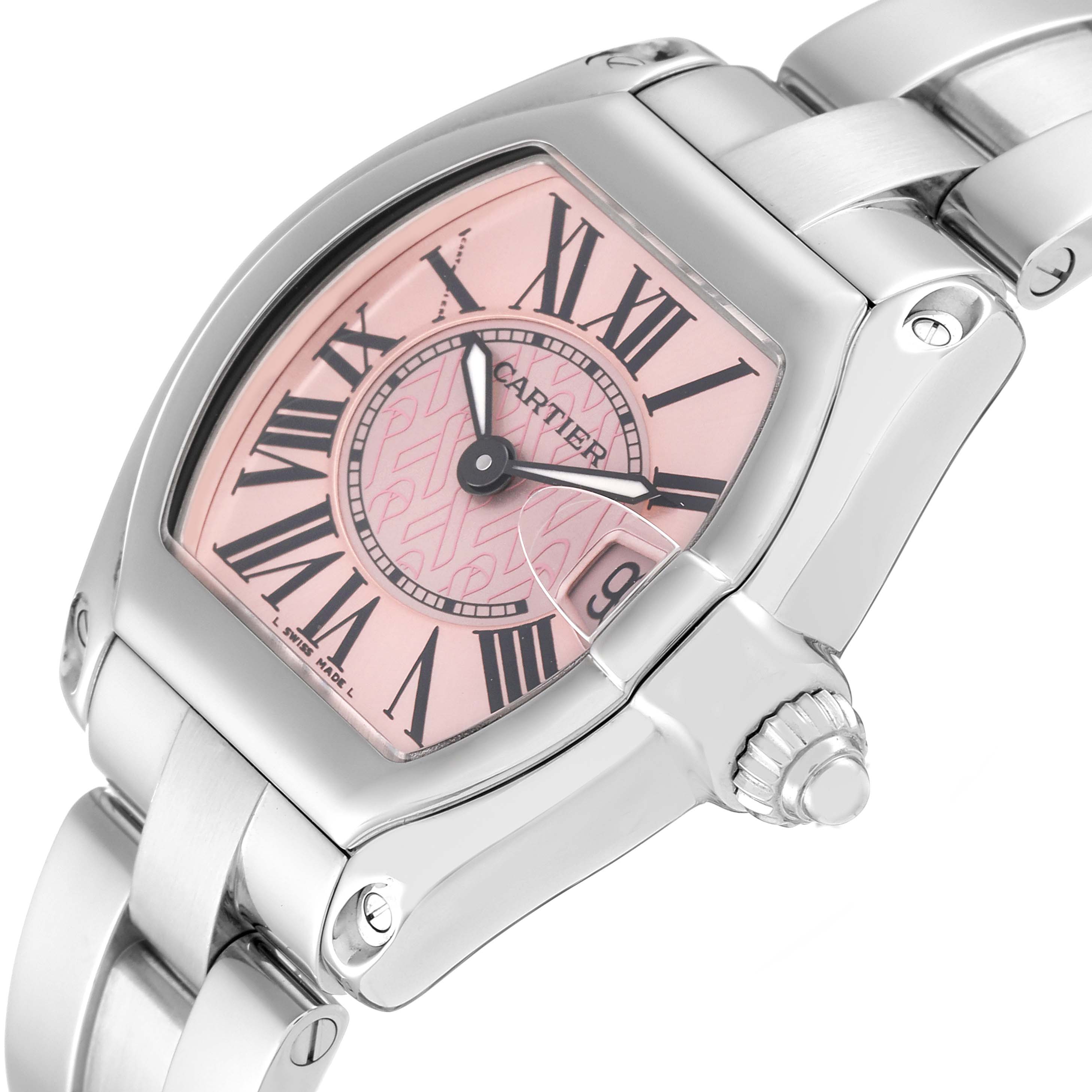 The image shows a close-up angle of a Cartier Roadster W62043V3 Women's Stainless Steel Pink Dial W62043V3 Women's Stainless Steel Pink Dial watch, highlighting its pink dial, Roman numerals, and stainless steel bracelet.