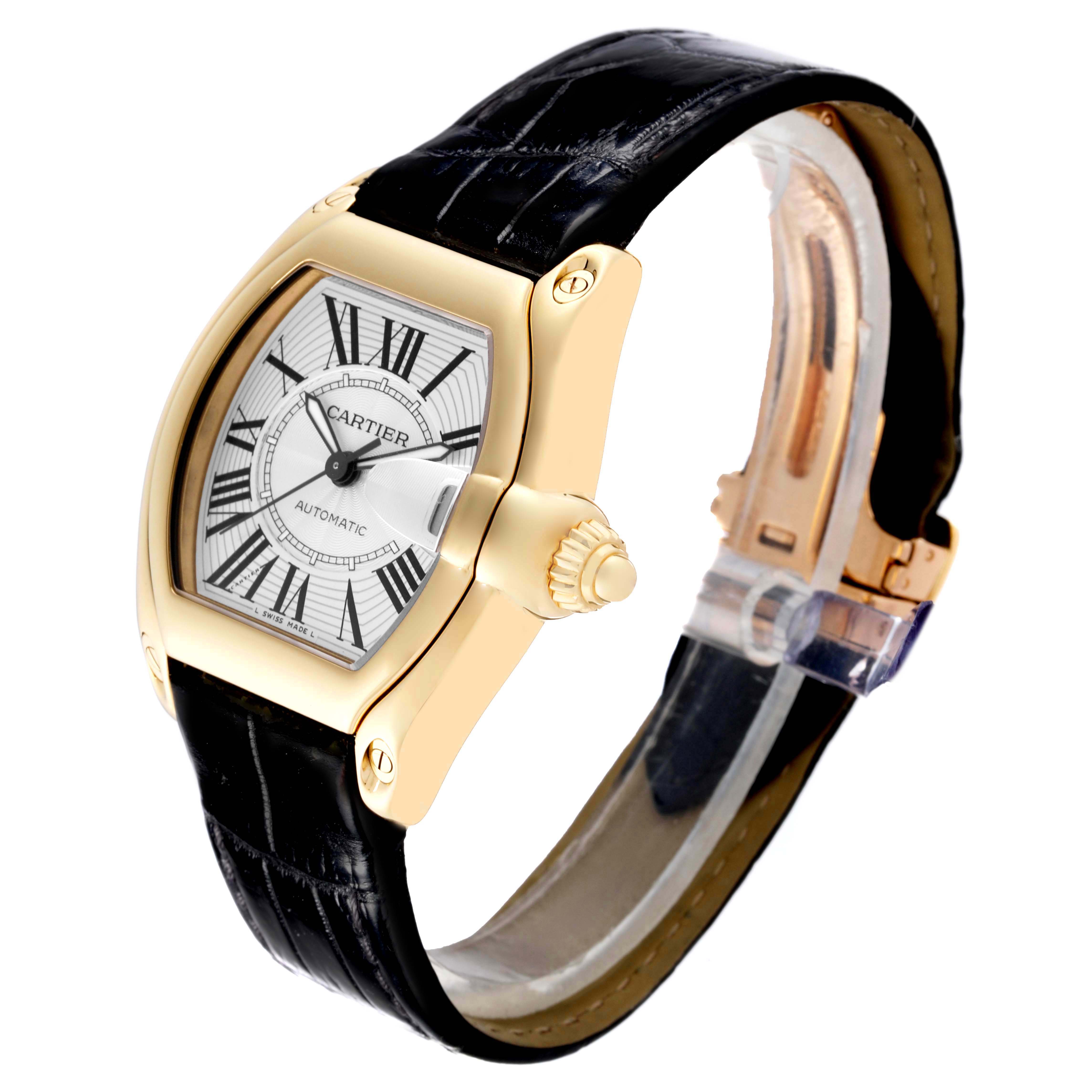 The Cartier Roadster W62005V2 Men's Yellow Gold Silver Dial W62005V2 Men's Yellow Gold Silver Dial watch is shown at a three-quarter angle, highlighting the dial, crown, and black leather strap.