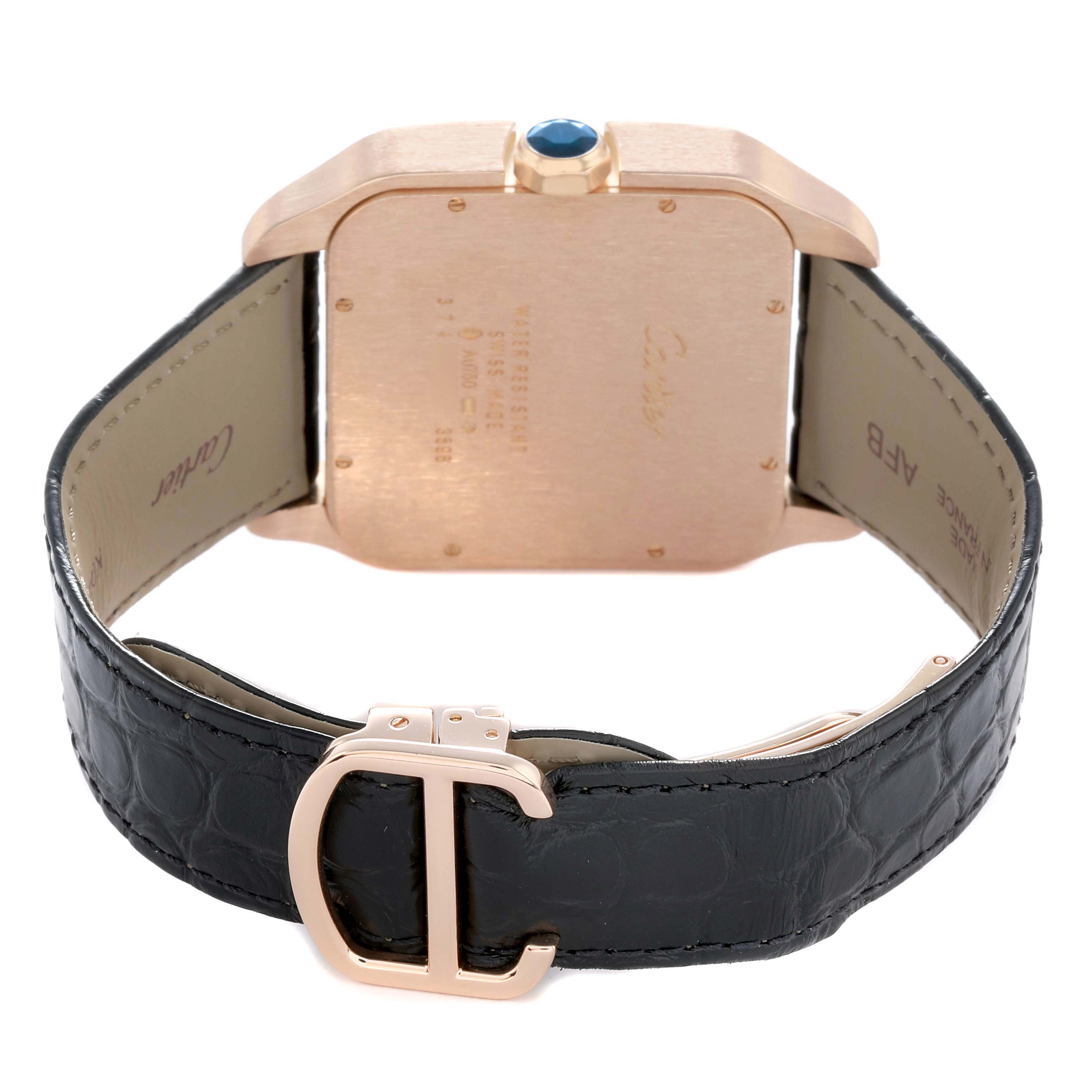 The image shows the back of a Cartier Santos Dumont W2020067 Men
s Rose Gold Silver Dial watch, highlighting the case, crown, strap, and buckle.