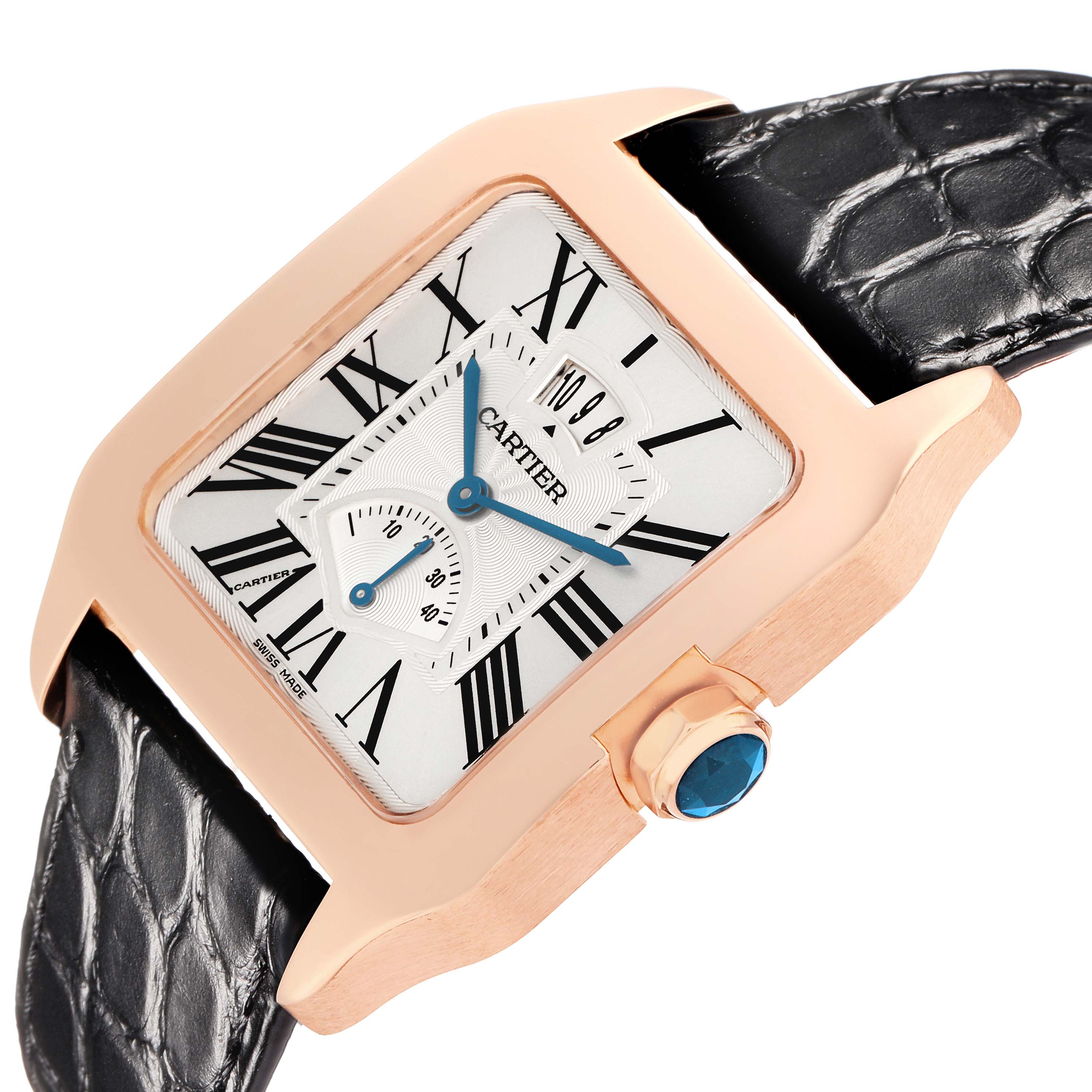 The Santos Dumont by Cartier is shown at an oblique angle displaying the dial, rose gold case, crown with a blue cabochon, and black strap.