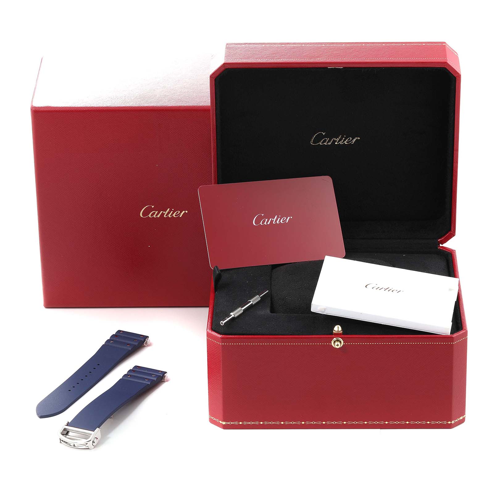 The image shows a Cartier Santos WSSA0048 Men
s Stainless Steel Silver Dial WSSA0048 Men
s Stainless Steel Silver Dial watch box with spare straps, a tool, and documentation at an angle.
