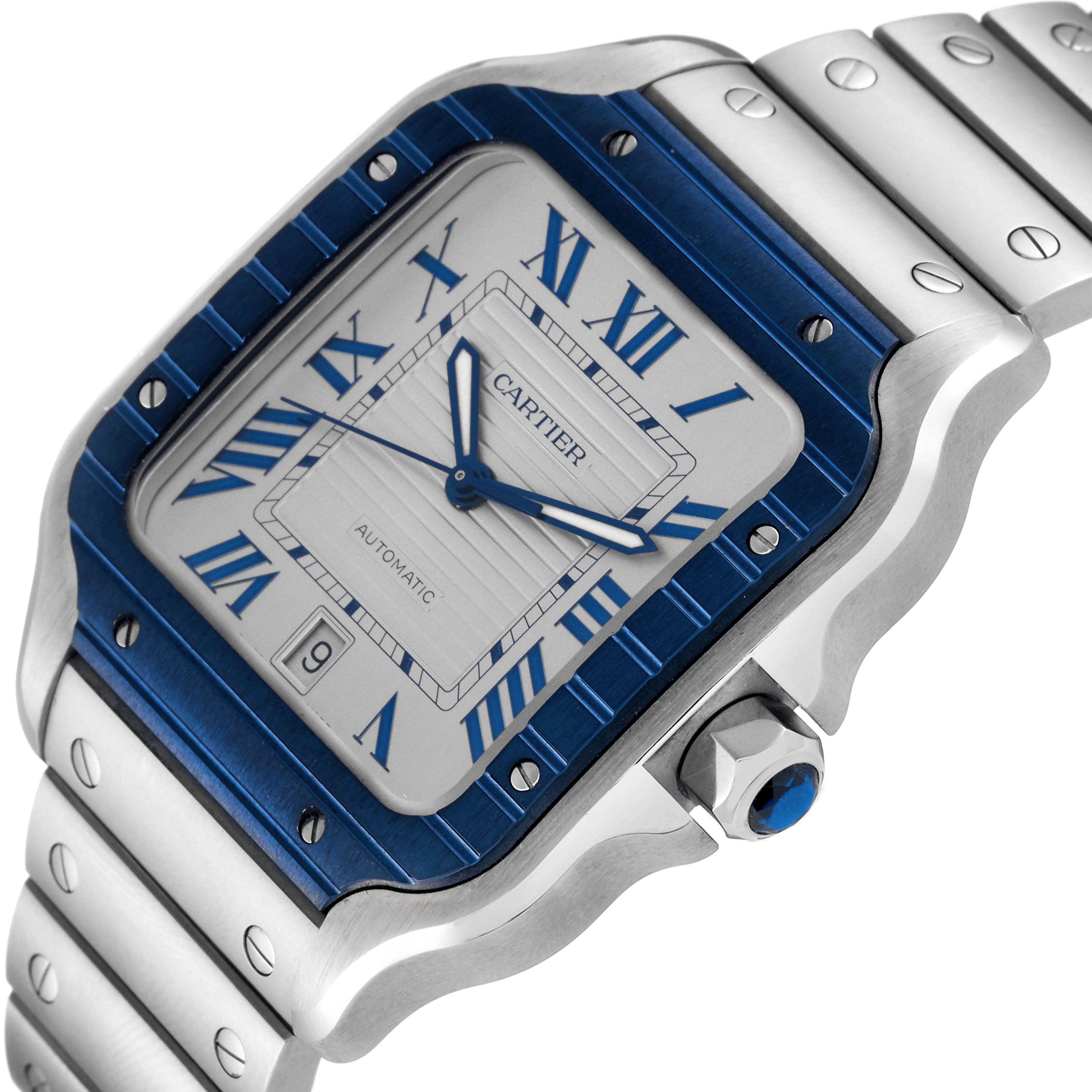 The image shows a close-up angle of the Cartier Santos WSSA0048 Men
s Stainless Steel Silver Dial WSSA0048 Men
s Stainless Steel Silver Dial model watch, highlighting its dial, bezel, and part of the bracelet.