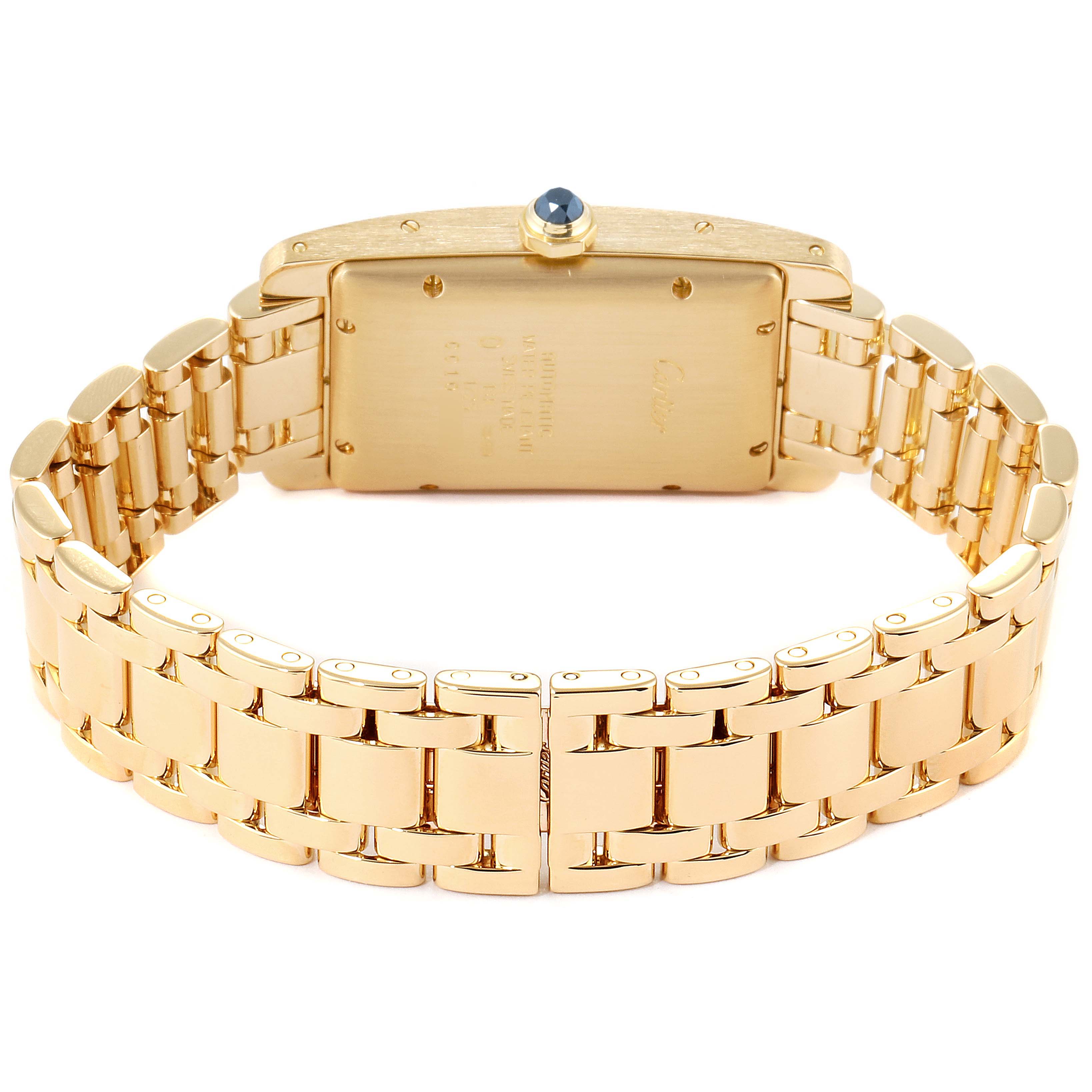 This image shows the back view of a Cartier Tank Americaine W26035K2 Women's Yellow Gold Silver Dial W26035K2 Women's Yellow Gold Silver Dial watch, highlighting its gold case, bracelet, and the crown with a blue cabochon.