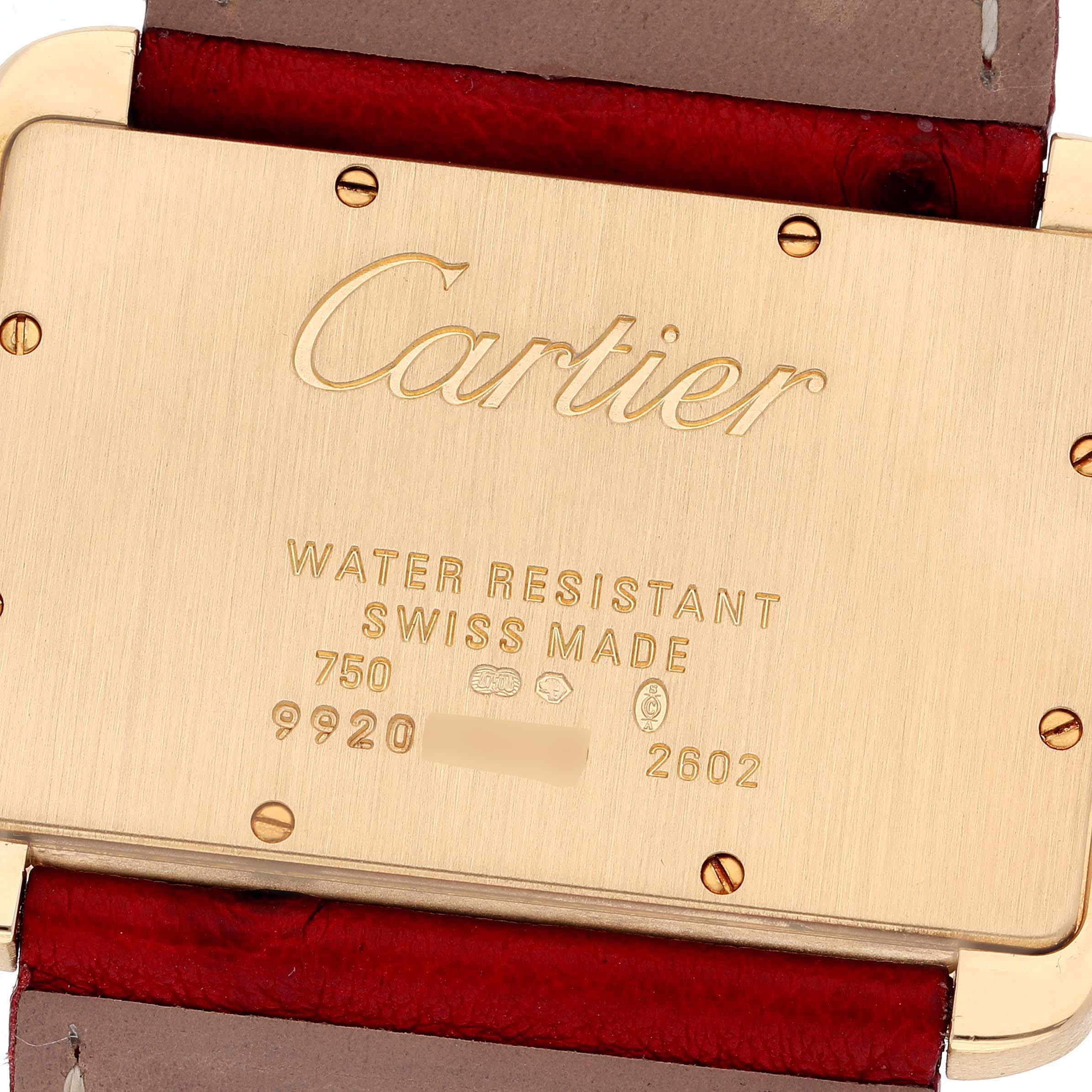 This image shows the back case of a Cartier Tank Divan W6300556‏ Women
s Yellow Gold Silver Dial W6300556‏ Women
s Yellow Gold Silver Dial watch, highlighting its branding and inscriptions.