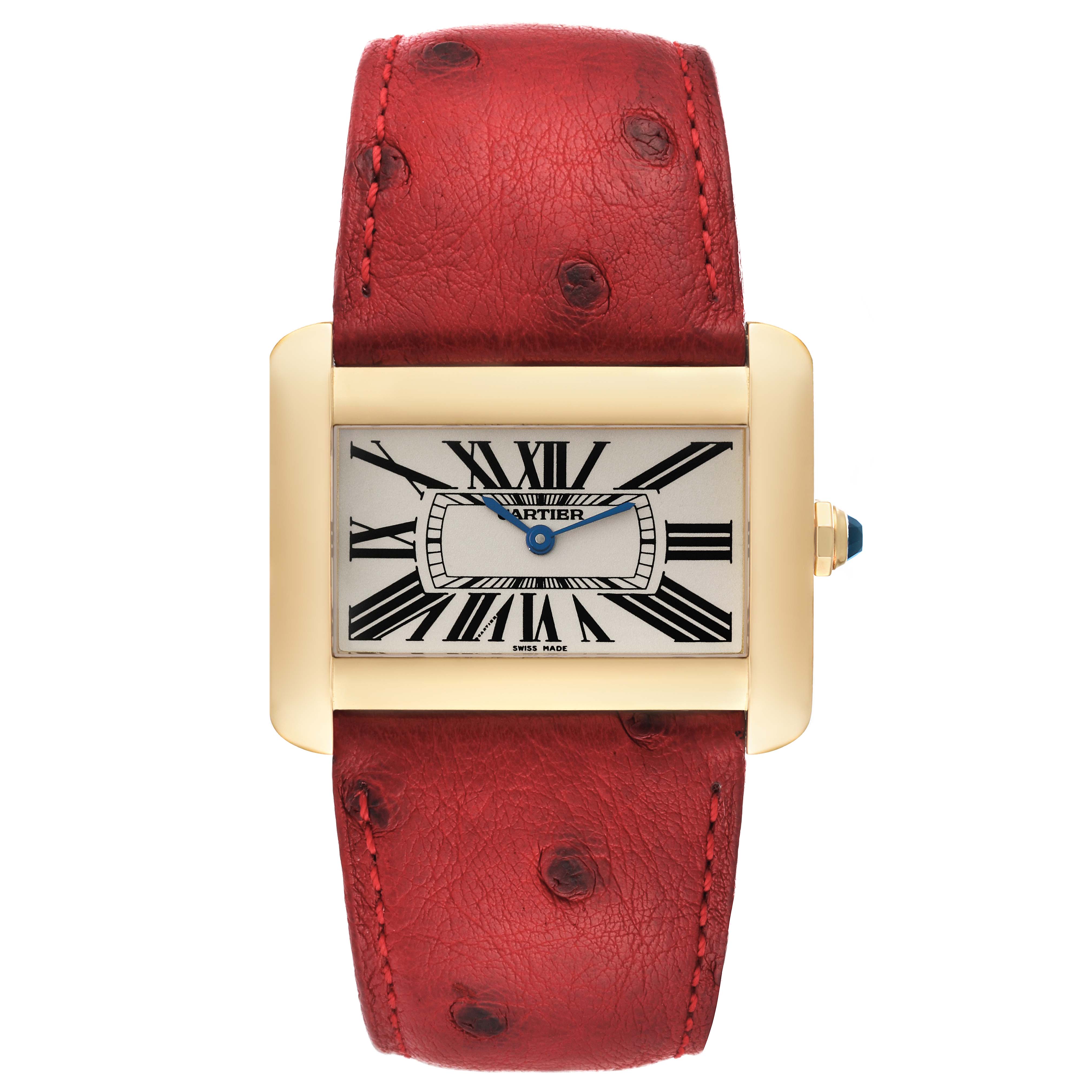 The image shows a front view of the Cartier Tank Divan W6300556‏ Women
s Yellow Gold Silver Dial W6300556‏ Women
s Yellow Gold Silver Dial watch featuring a red ostrich leather strap and rectangular face with Roman numerals.