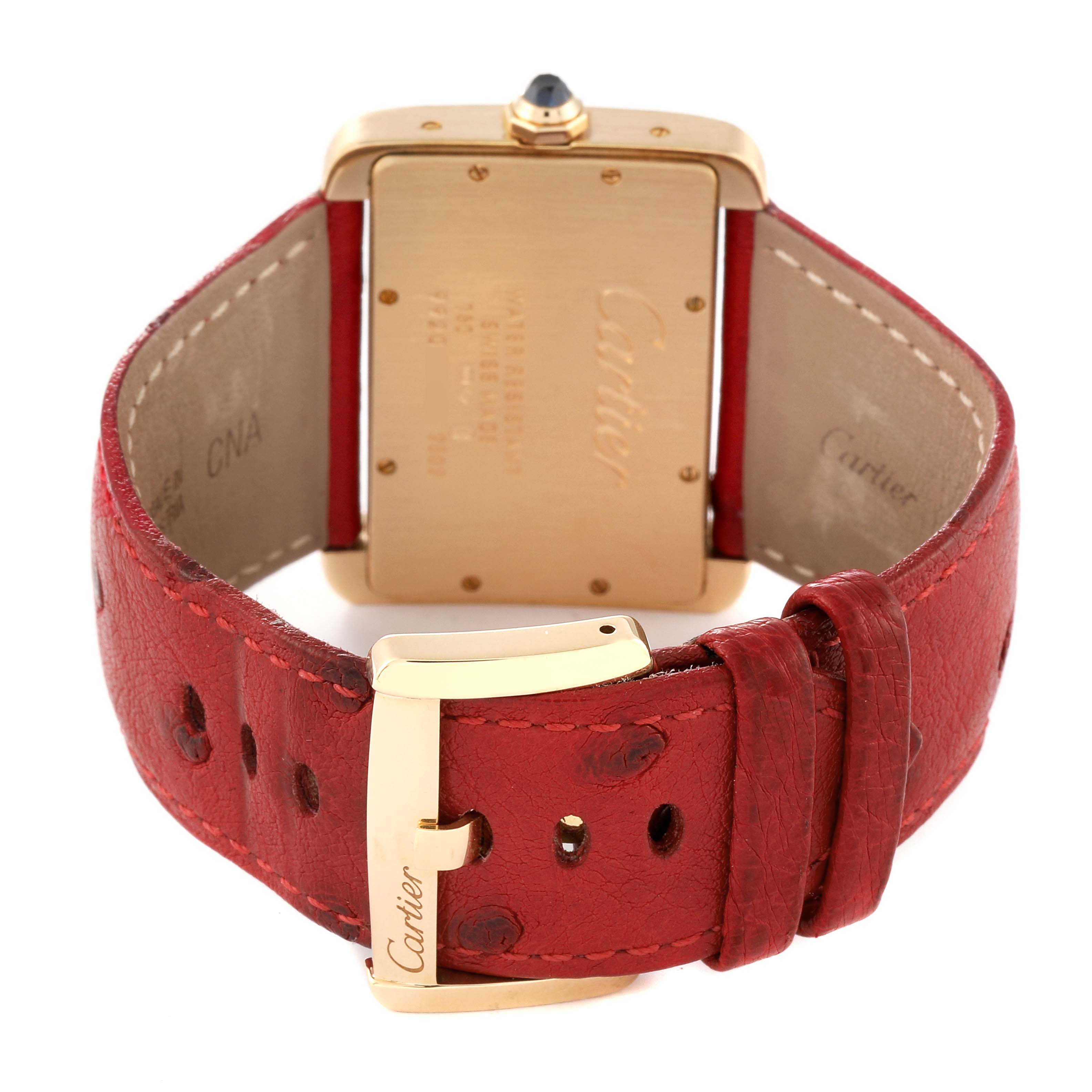 The image shows the back view of the Cartier Tank Divan W6300556‏ Women
s Yellow Gold Silver Dial W6300556‏ Women
s Yellow Gold Silver Dial watch, focusing on the case back and the red leather strap with a Cartier-marked buckle.