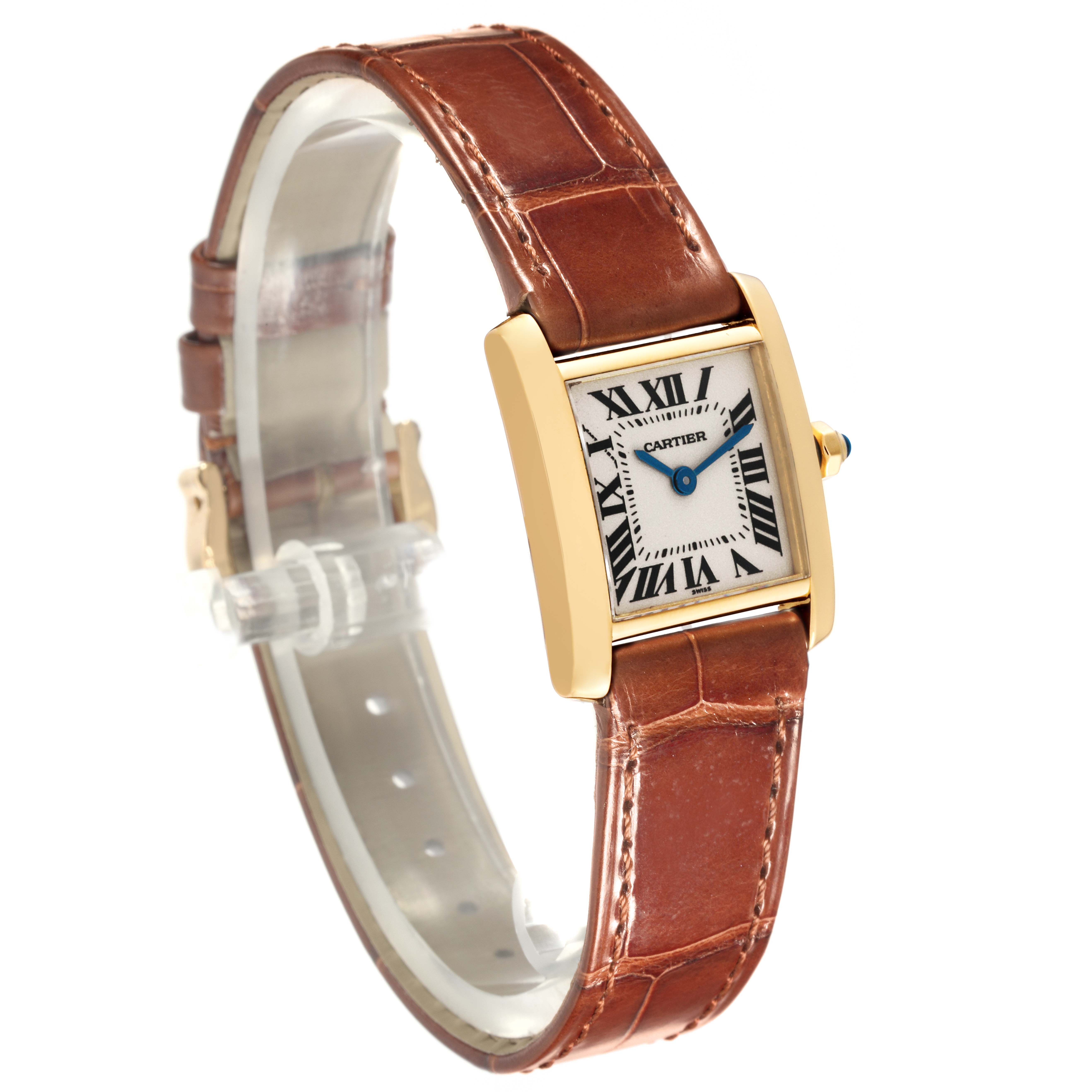 The Cartier Tank Française is shown at a three-quarter angle, highlighting the gold case, white dial, and brown leather strap.