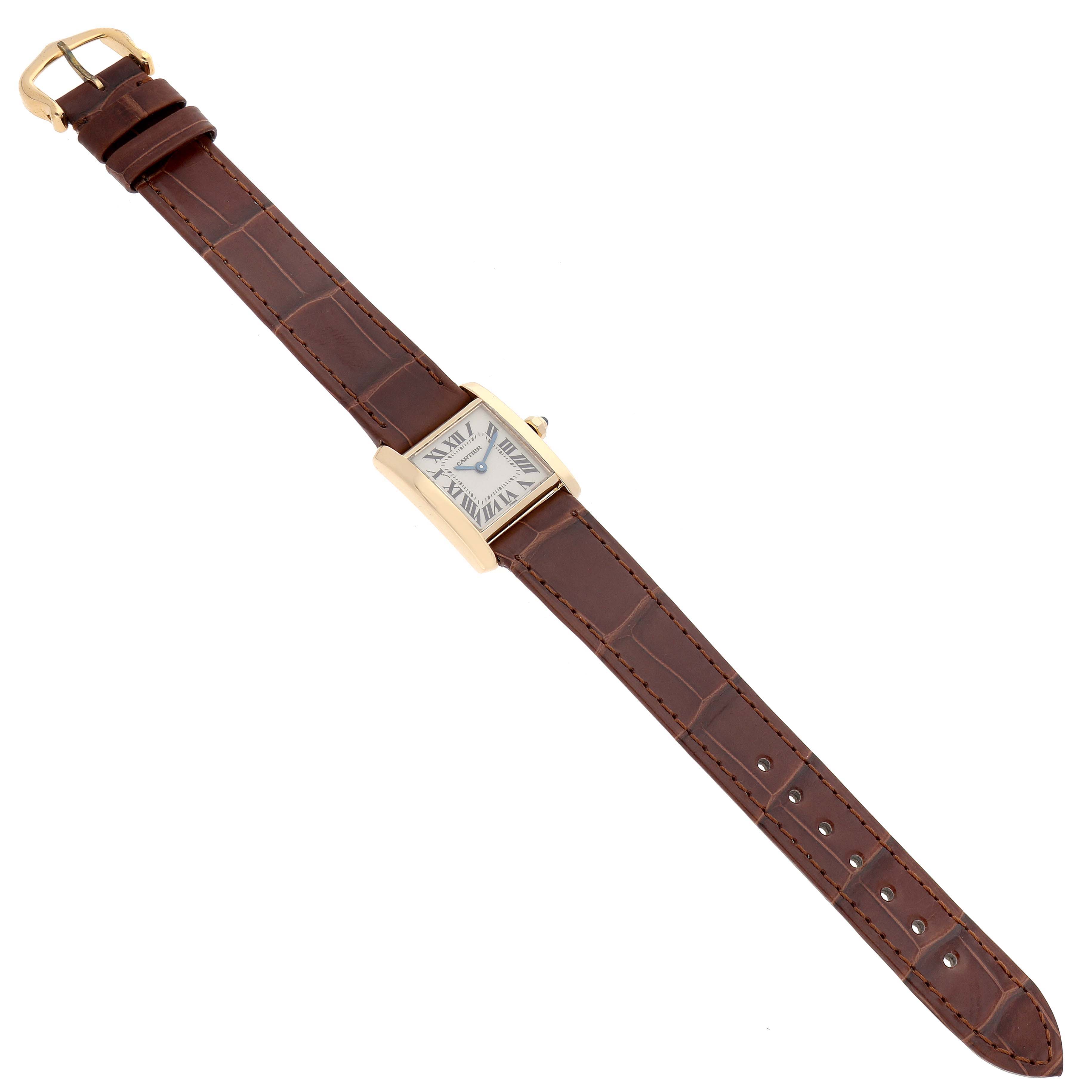 The Cartier Tank Française watch is shown in a top-down view, displaying its face, rectangular case, and entire leather strap.
