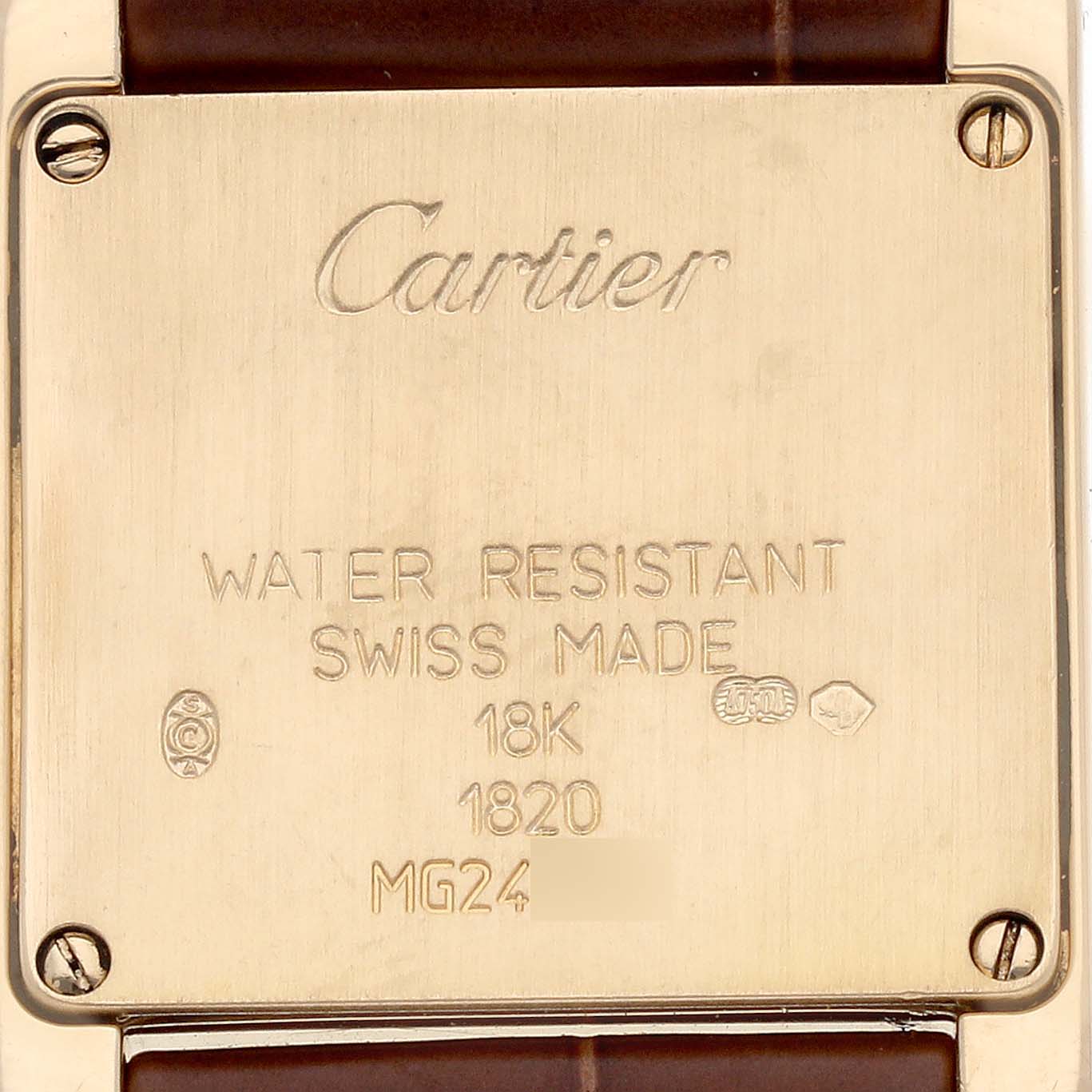 The image shows the back of a Cartier Tank Française watch, featuring engravings and four screws in the corners.