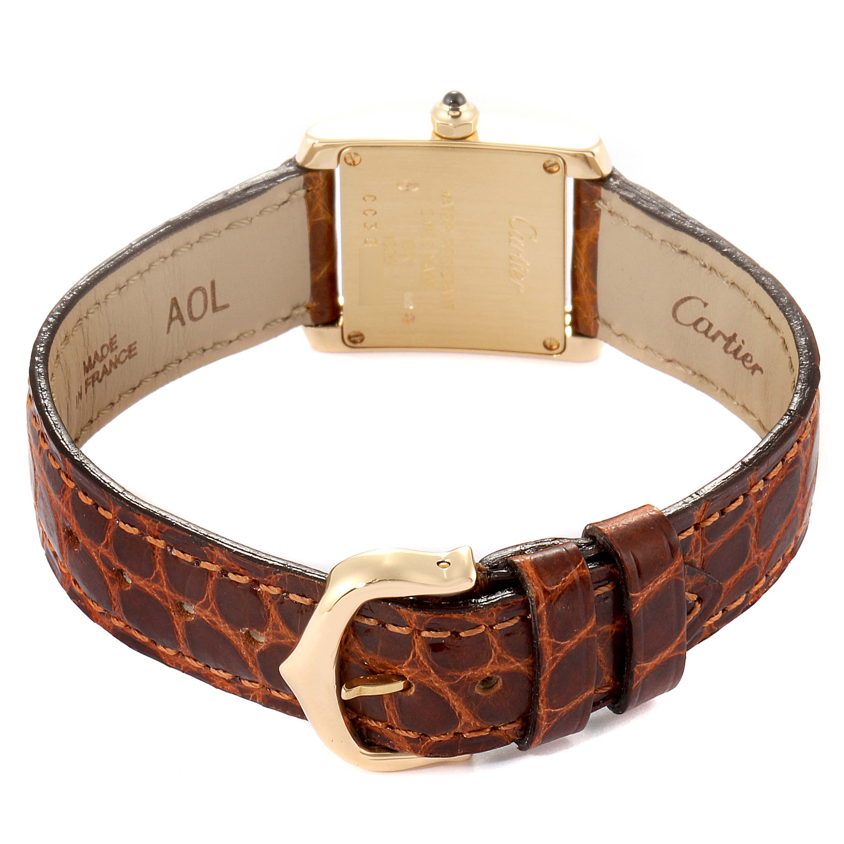 The image shows the back view of the Cartier Tank Francaise W5000256 Women's Yellow Gold Silver Dial W5000256 Women's Yellow Gold Silver Dial watch and its brown leather strap.