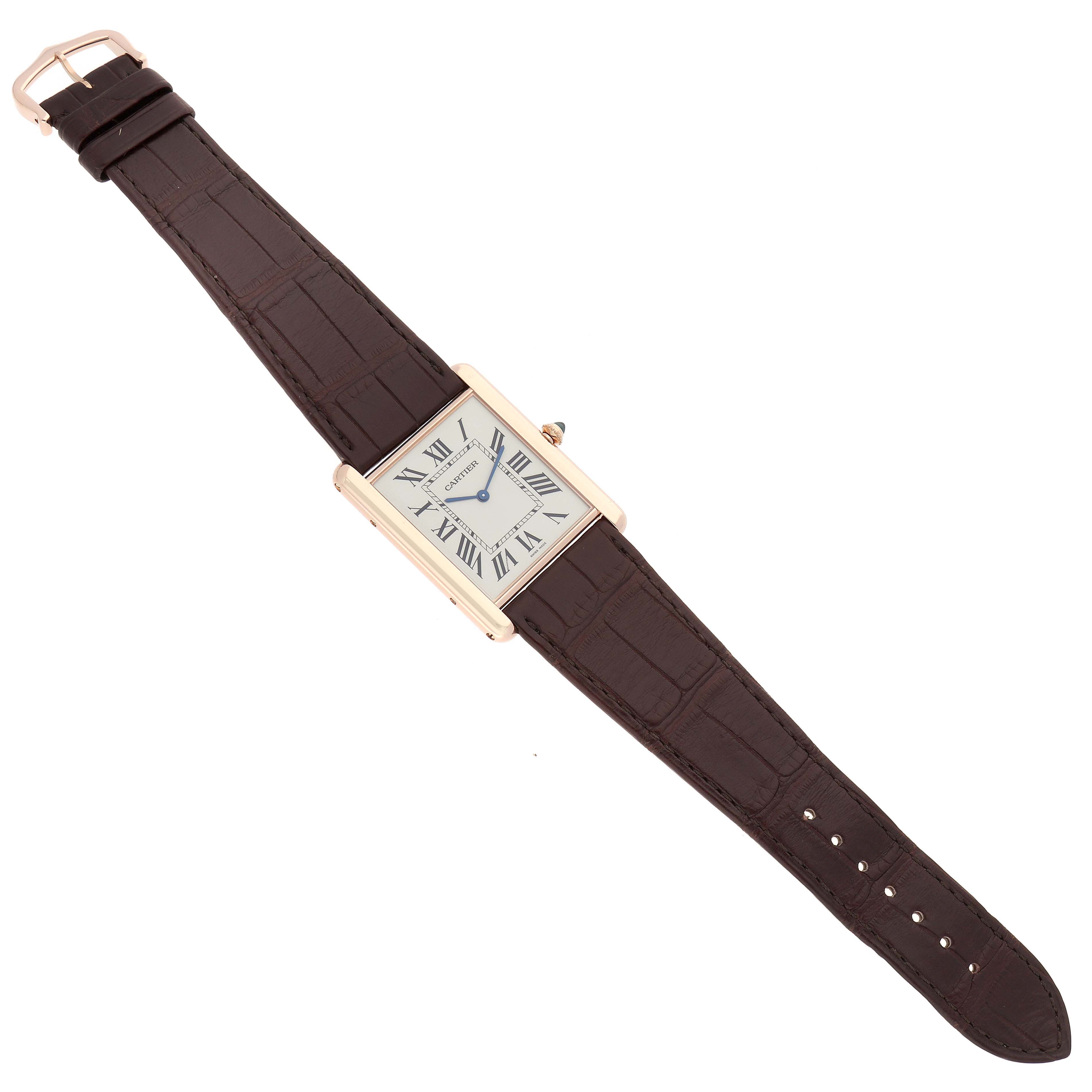 The Cartier Tank Louis W1560017 Men
s Rose Gold Silver Dial watch is displayed from a top-down angle, fully showing the rectangular face and brown leather strap.