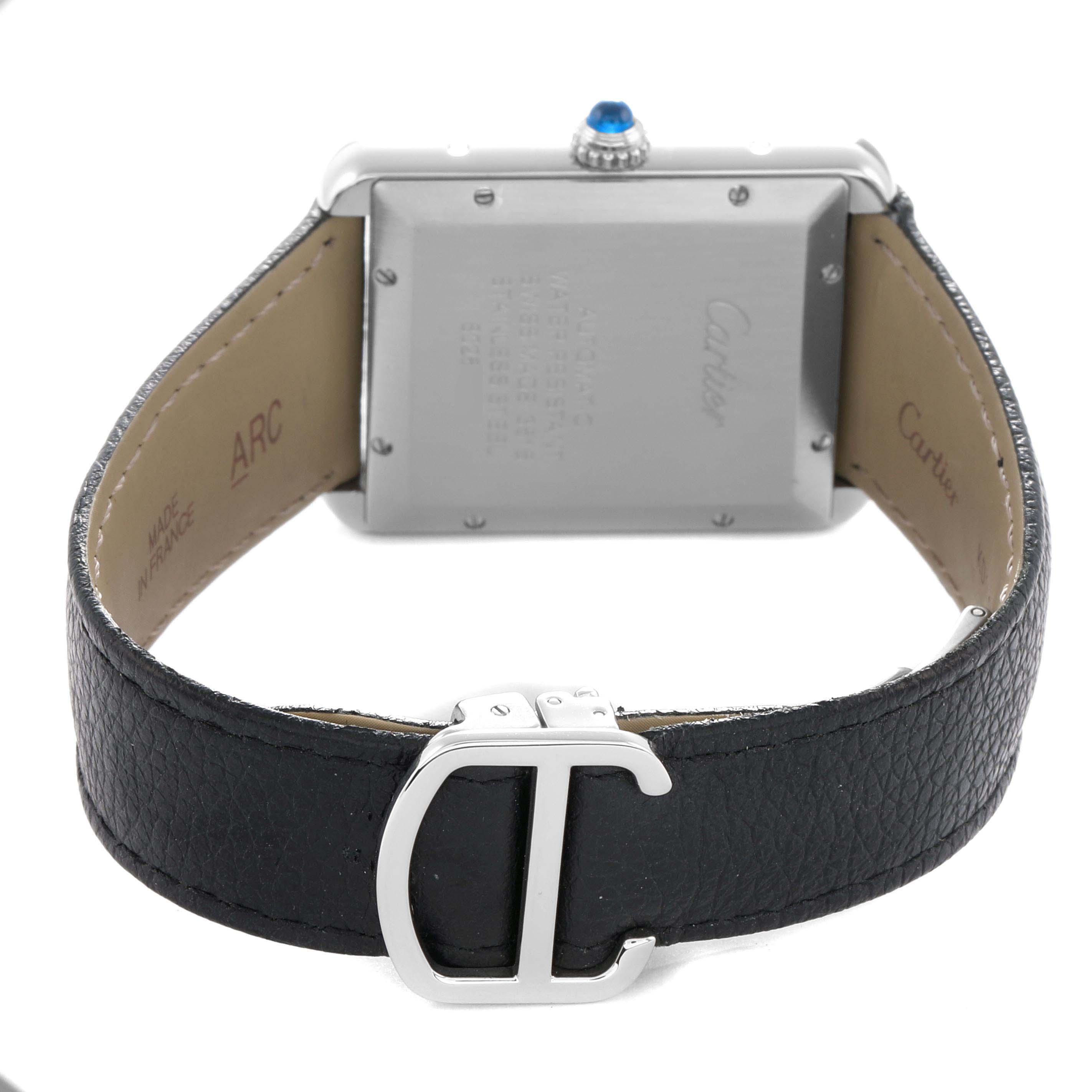 The image shows the back view of a Cartier Tank Solo 73949 Men
s Stainless Steel Silver Dial watch, highlighting the case, crown, and leather strap with buckle.