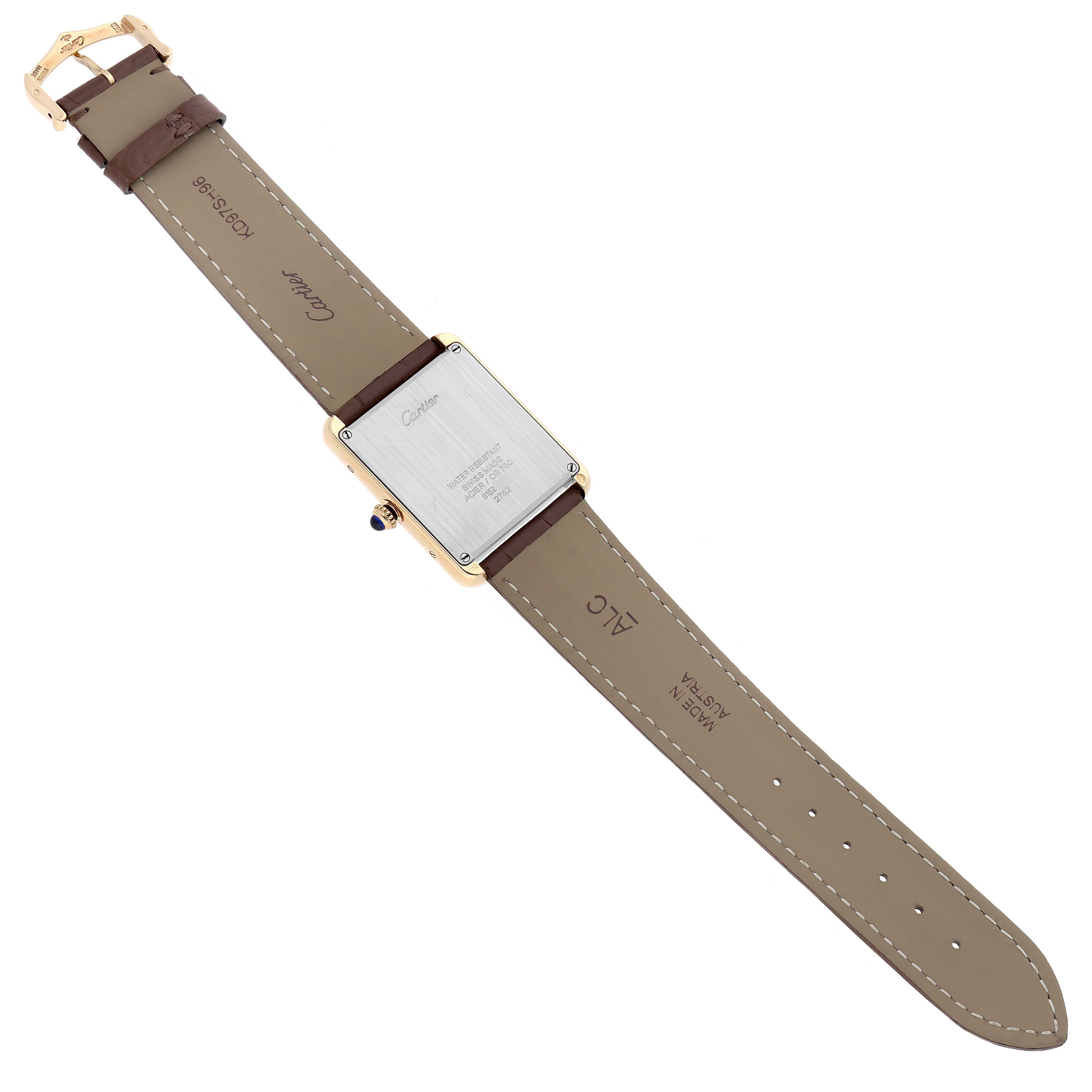 The Cartier Tank Solo W1018855 Men
s Steel and Gold (two tone) Silver Dial watch is shown from the back, displaying the case back and leather strap.