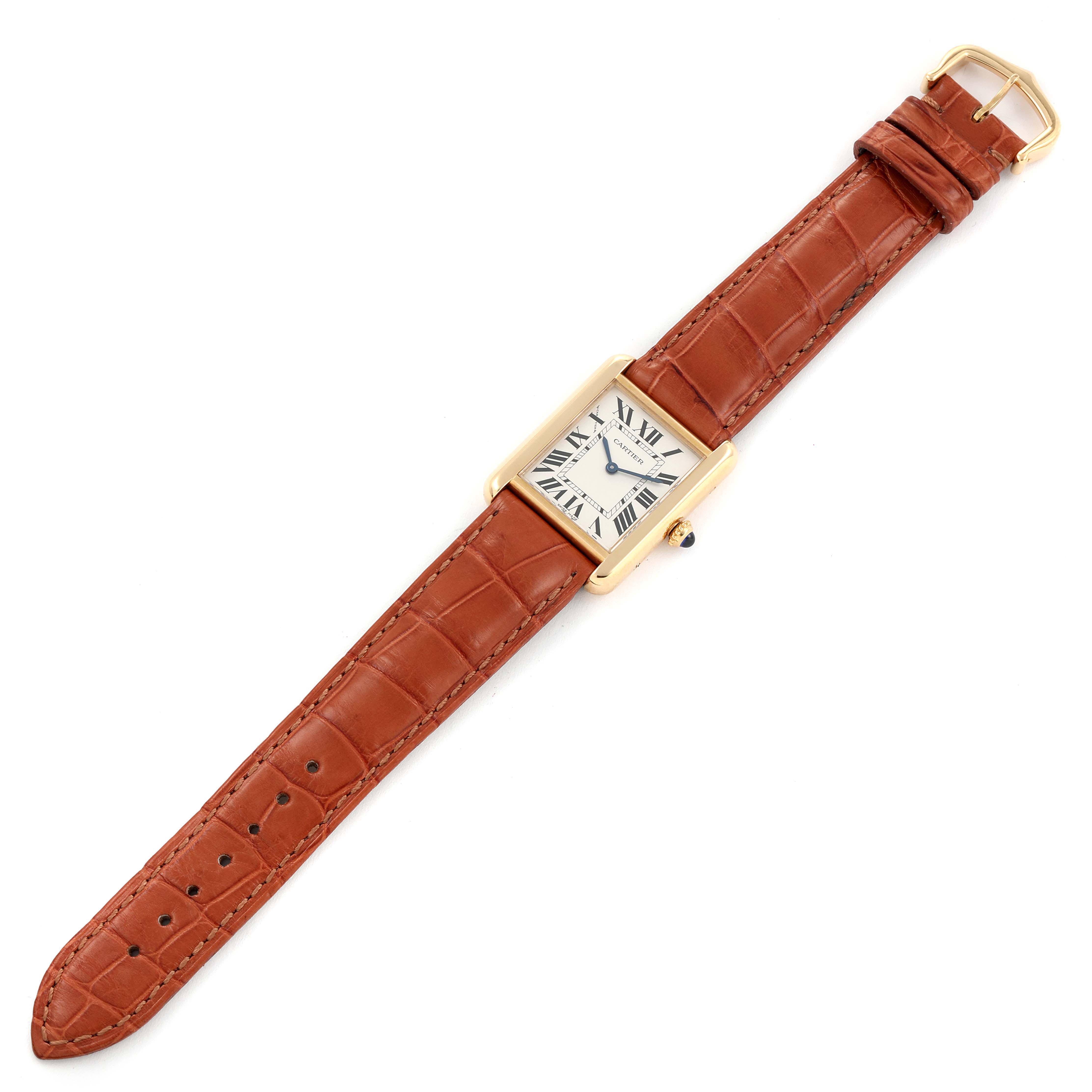 This image shows a top-down view of the Cartier Tank Solo W5200002 Women's Yellow Gold Silver Dial W5200002 Women's Yellow Gold Silver Dial watch with its brown leather strap fully extended.