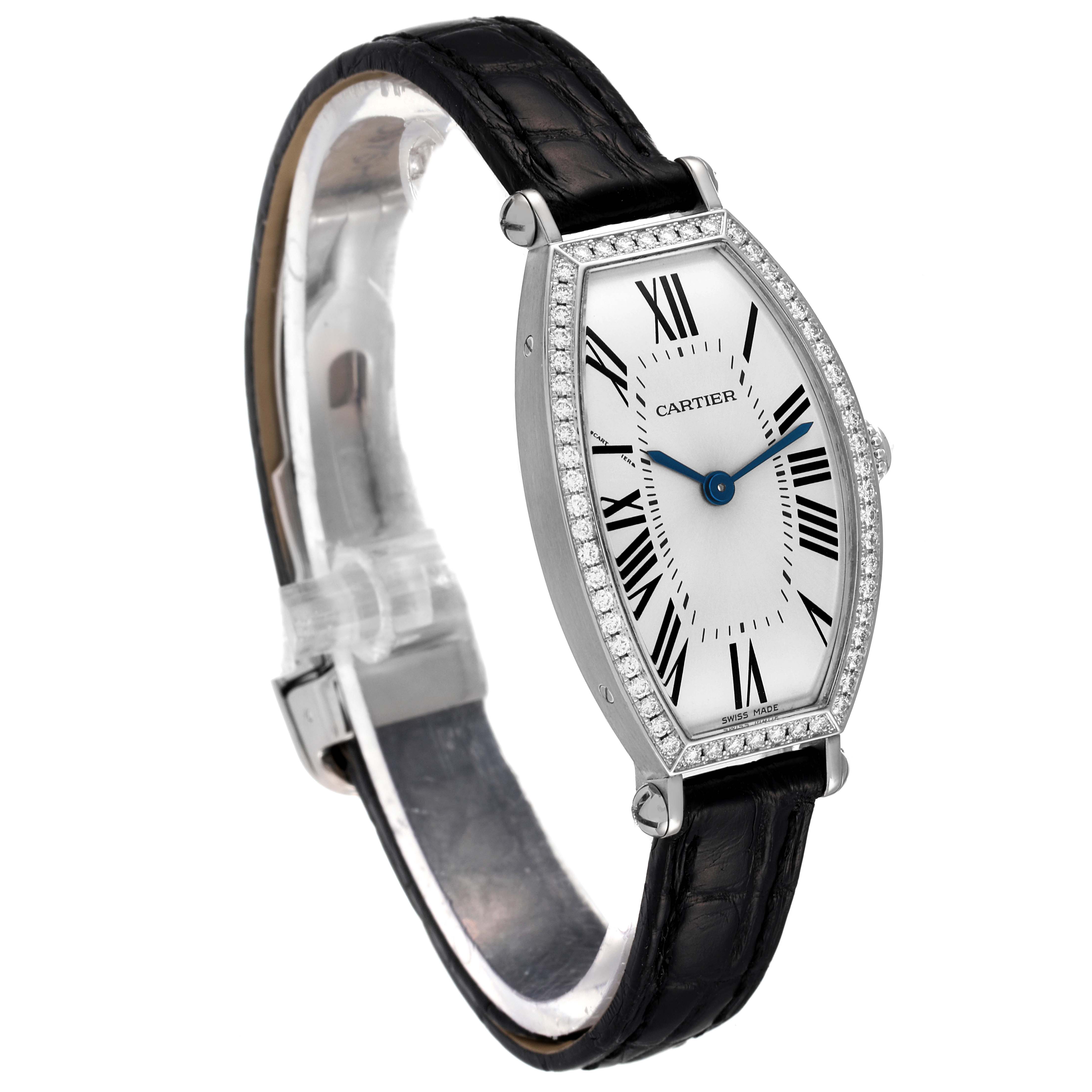 This image shows a Cartier Tortue WE400131 Women
s White Gold Silver Dial WE400131 Women
s White Gold Silver Dial watch at an angled side view, displaying its face, bezel, and leather strap.