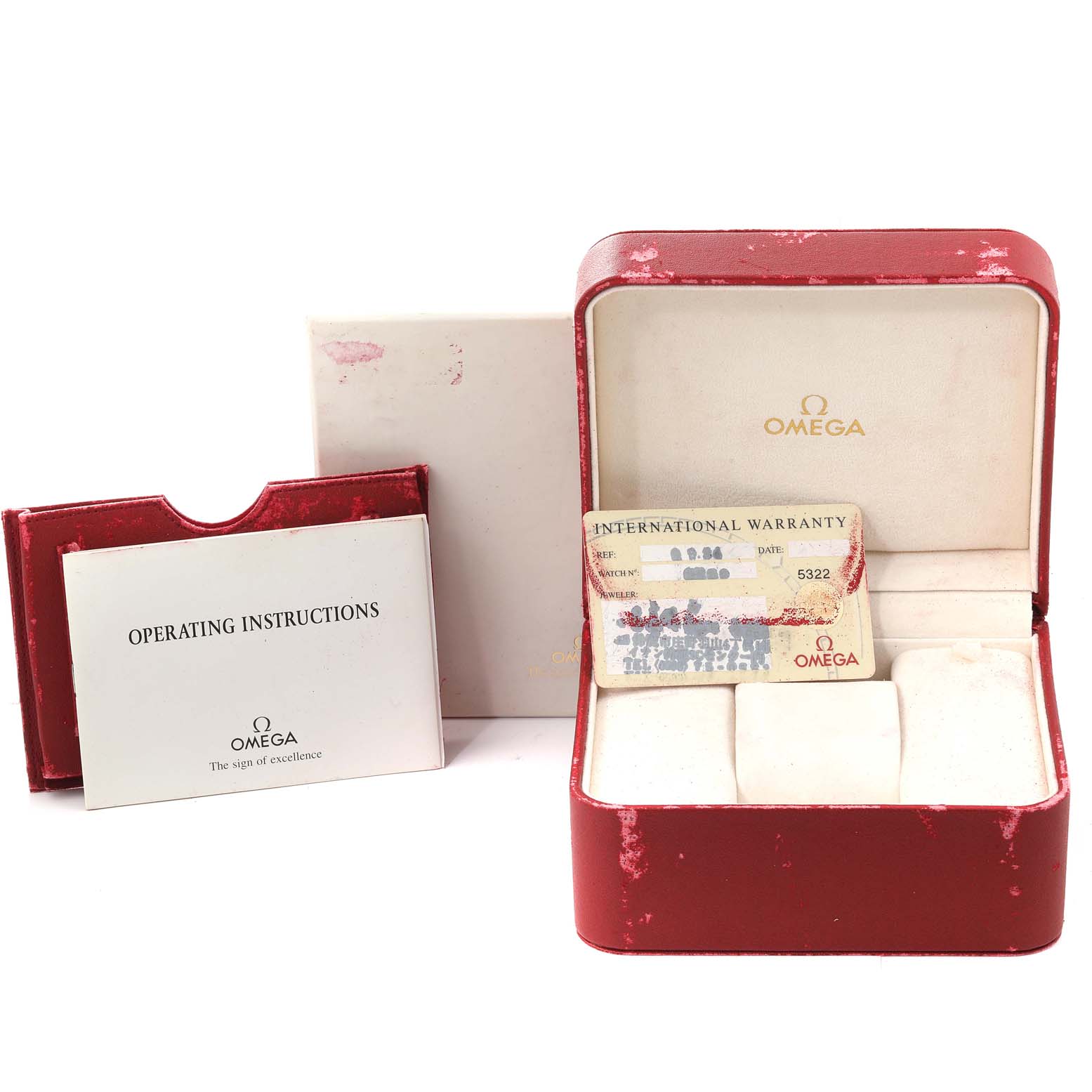 The image shows the accessories of an Omega Seamaster 2531.80.00 Men's Stainless Steel Blue Dial 2531.80.00 Men's Stainless Steel Blue Dial watch, including the box, warranty card, and operating instructions.