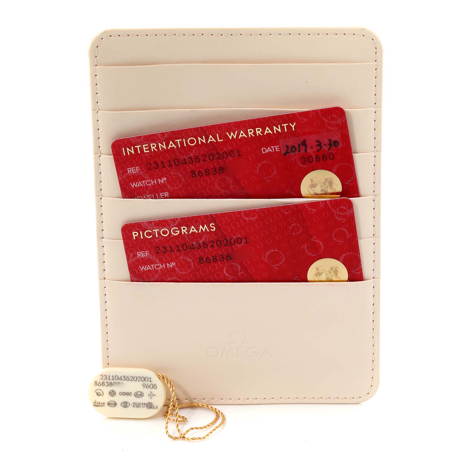 The image shows an Omega Aqua Terra 231.10.43.52.02.001 Men's Stainless Steel Silver Dial 231.10.43.52.02.001 Men's Stainless Steel Silver Dial model's accessories, including the international warranty and pictograms cards and a tag, displayed frontally.