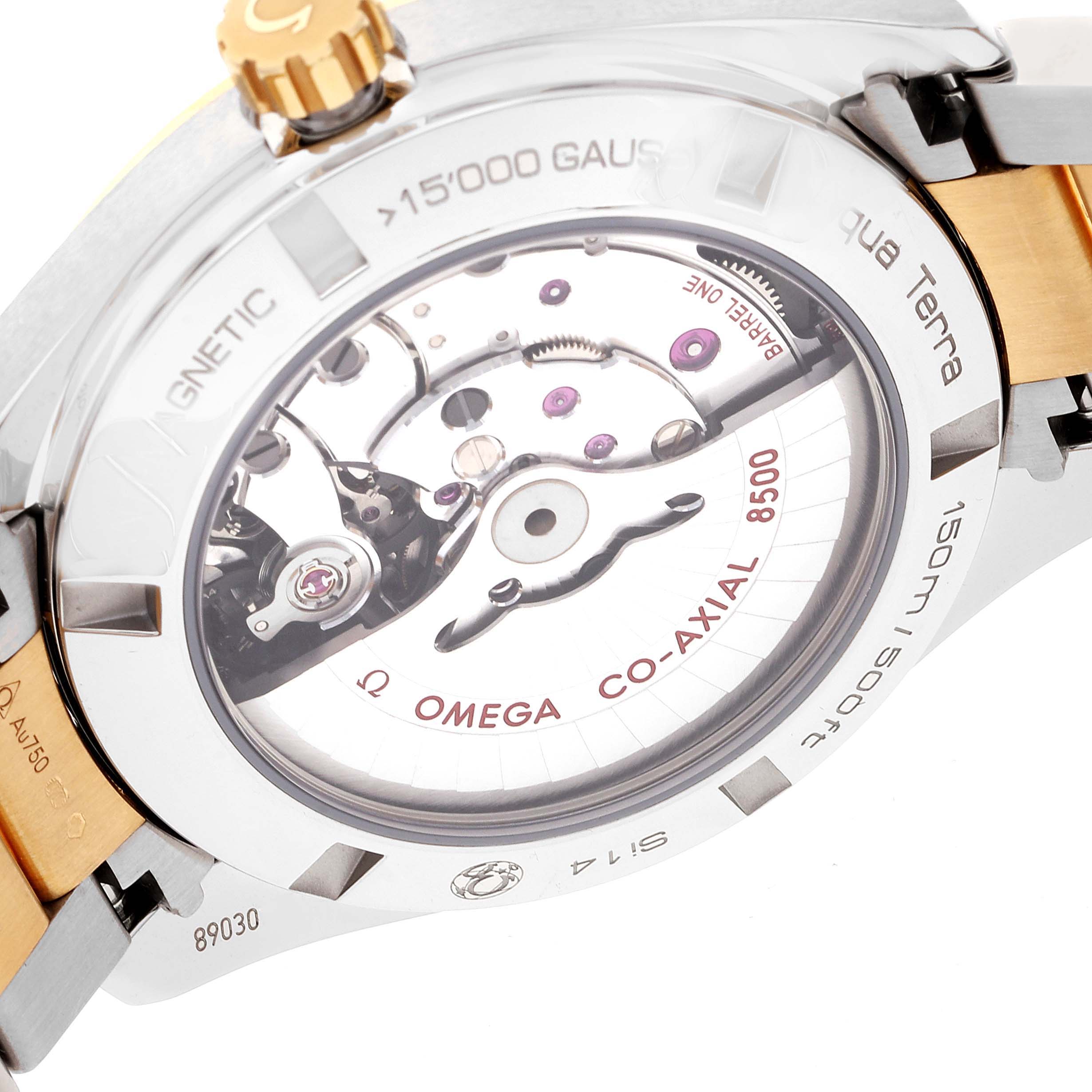 The image shows the back view of an Omega Aqua Terra 231.20.42.21.08.001 Men
s Steel and Gold (two tone) Champagne Dial 231.20.42.21.08.001 Men
s Steel and Gold (two tone) Champagne Dial watch, highlighting its co-axial movement and transparent case back.