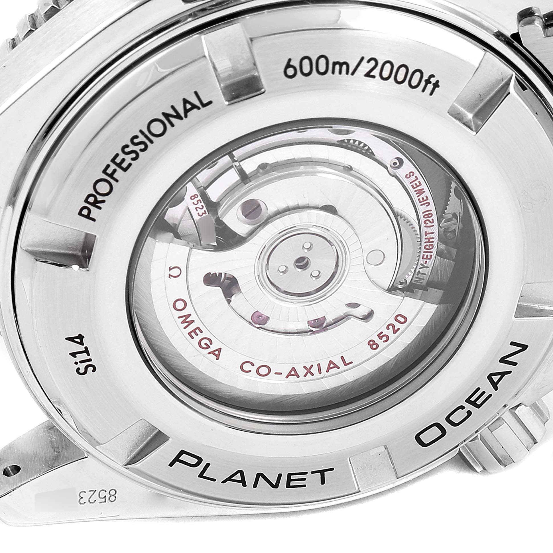 The image shows the back of an Omega Seamaster 232.30.38.20.01.002 Men
s Stainless Steel Black Dial 232.30.38.20.01.002 Men
s Stainless Steel Black Dial Planet Ocean watch, focusing on its co-axial movement and water resistance details.