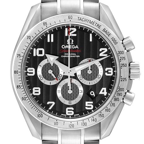 The Omega Speedmaster watch is shown from a front angle, displaying the face, dials, tachymeter bezel, and part of the bracelet.