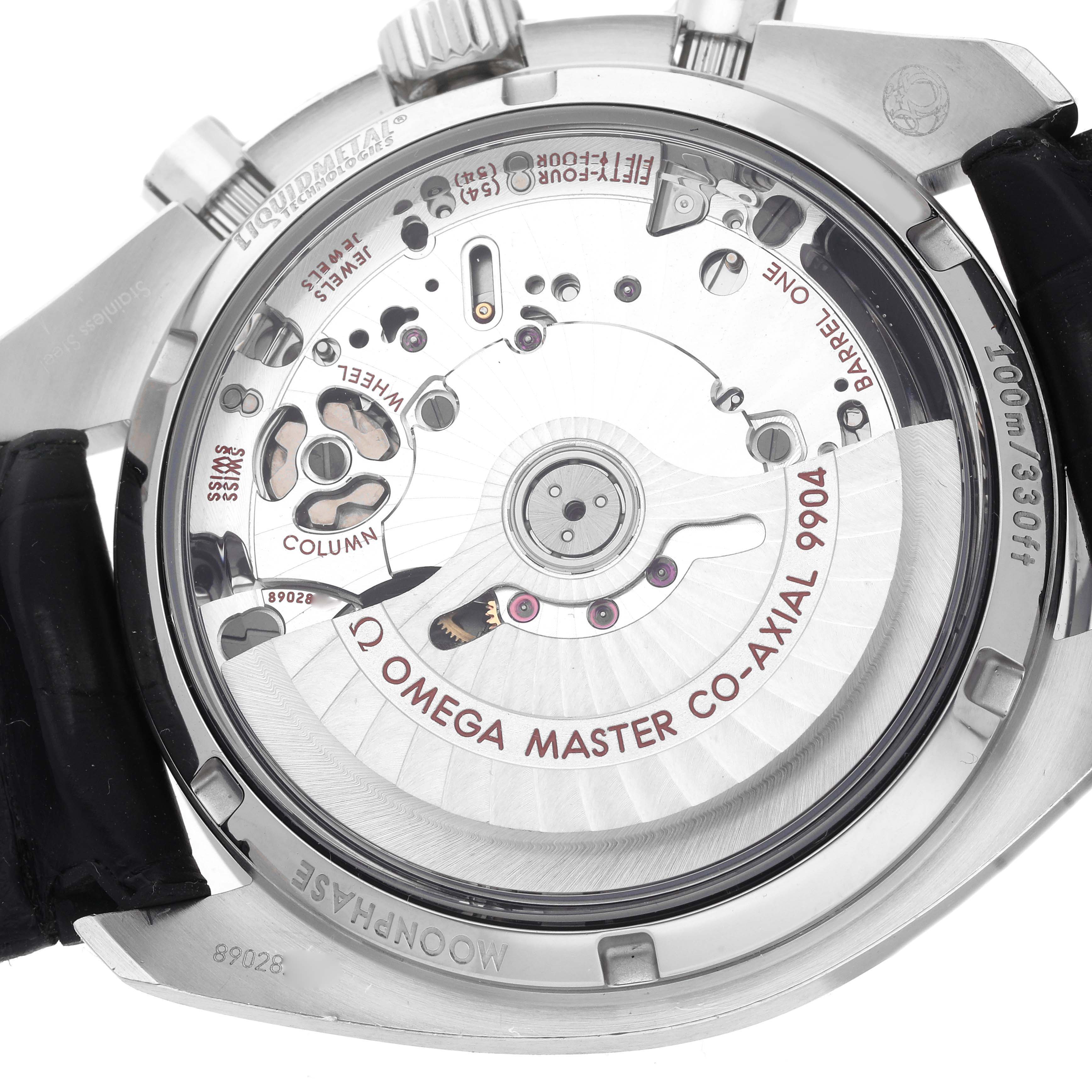 The image shows the back of an Omega Speedmaster 304.33.44.52.01.001 Men
s Stainless Steel Black Dial 304.33.44.52.01.001 Men
s Stainless Steel Black Dial, highlighting the Co-Axial movement and inner mechanics.