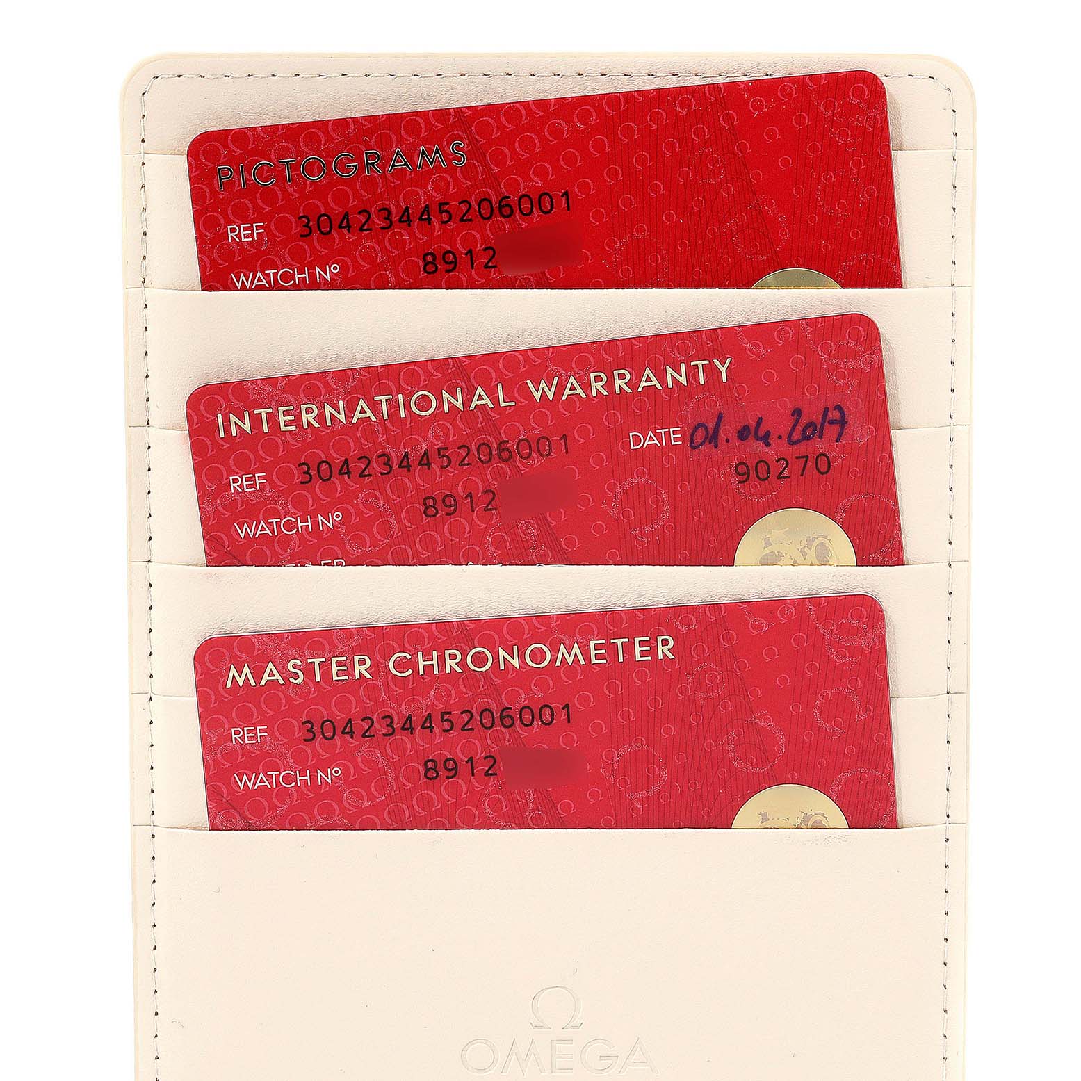 The image shows the warranty cards in a holder for the Omega Speedmaster 304.23.44.52.06.001 Men's Steel and Gold (two tone) Grey Dial 304.23.44.52.06.001 Men's Steel and Gold (two tone) Grey Dial watch.