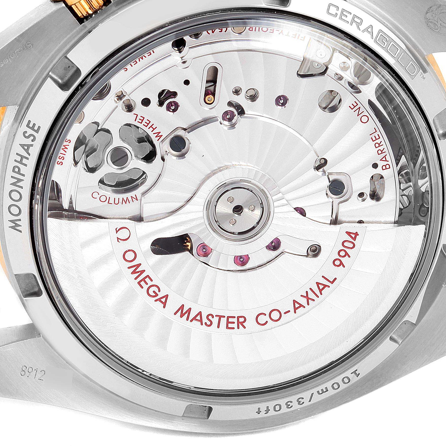 The image shows the back view of the Omega Speedmaster 304.23.44.52.06.001 Men's Steel and Gold (two tone) Grey Dial 304.23.44.52.06.001 Men's Steel and Gold (two tone) Grey Dial, highlighting the inner mechanical components and engravings.