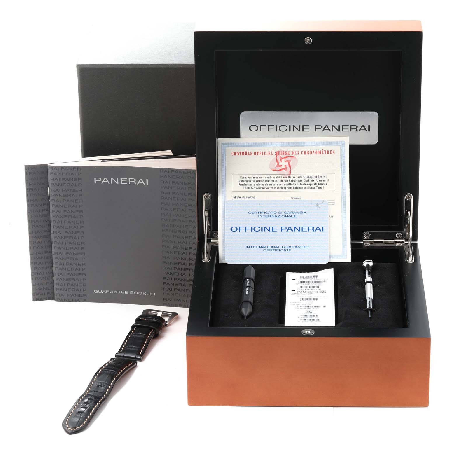 The image shows the packaging and accessories of the Panerai Luminor PAM00244 Men
s Stainless Steel Black Dial PAM00244 Men
s Stainless Steel Black Dial watch, including booklets, tools, and an additional strap.