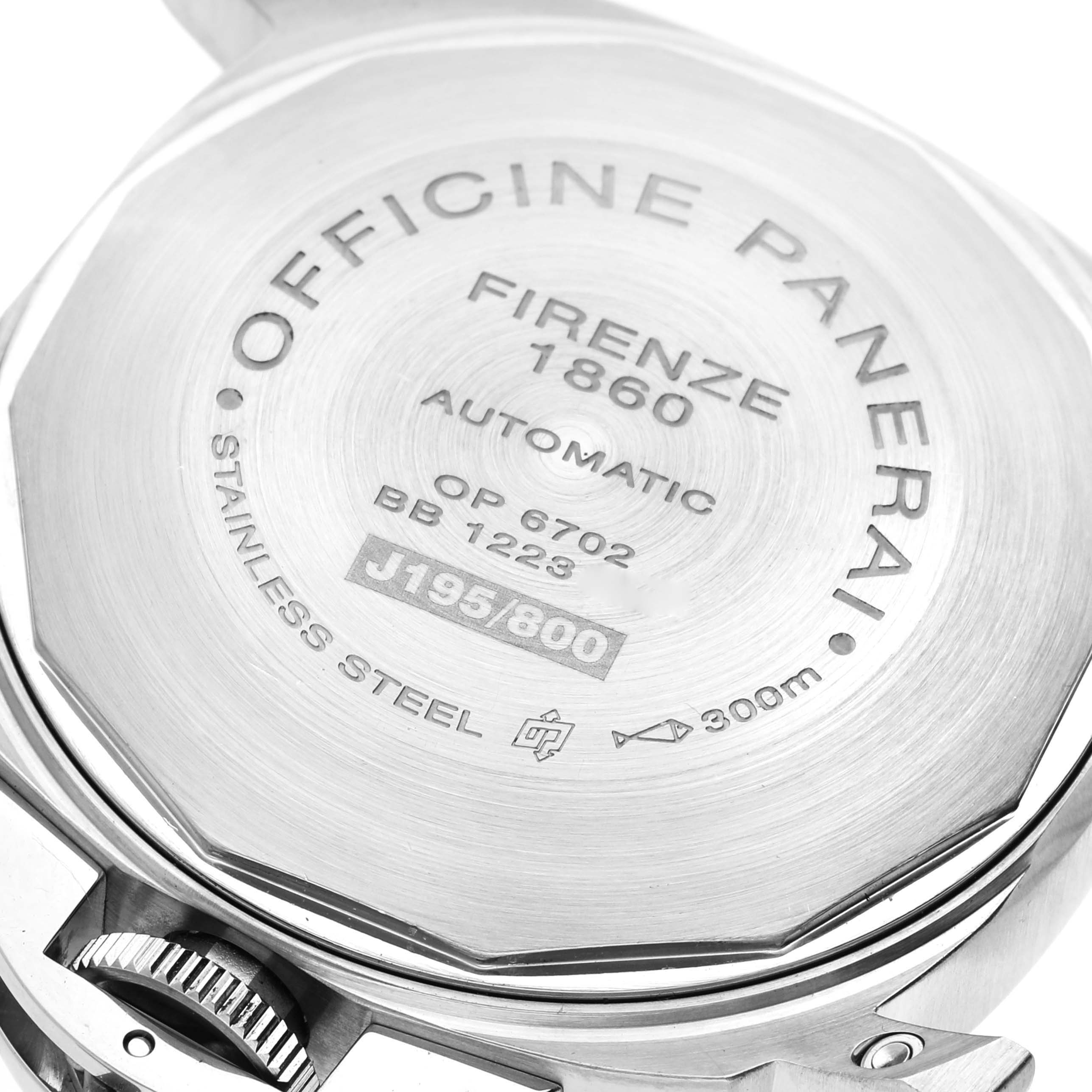 This image shows a close-up of the case back of a Panerai Luminor PAM00244 Men
s Stainless Steel Black Dial PAM00244 Men
s Stainless Steel Black Dial watch, displaying engravings and the crown.