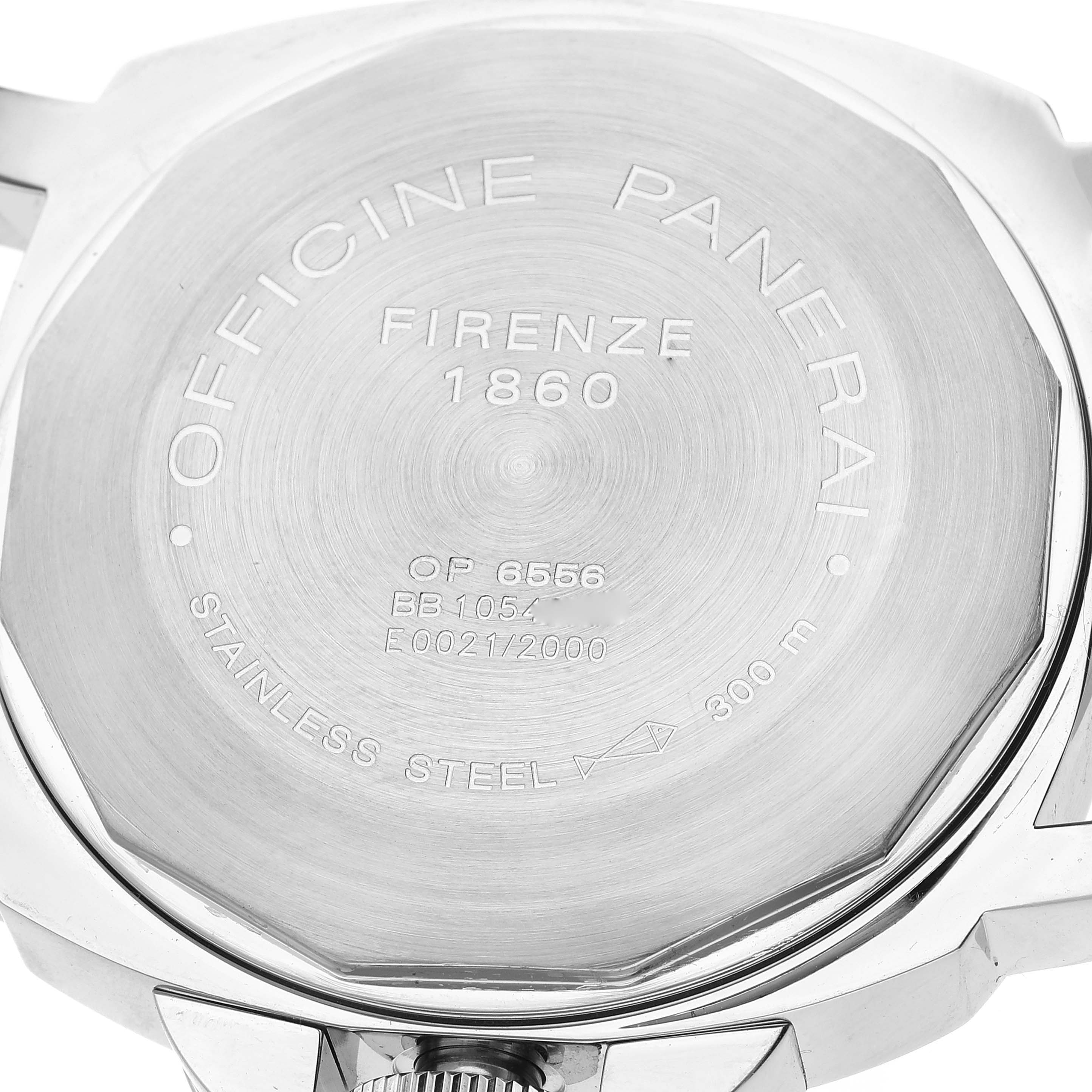 The image shows the back case of a Panerai Luminor PAM00090 Men's Stainless Steel Black Dial PAM00090 Men's Stainless Steel Black Dial watch, highlighting various engravings and serial numbers.