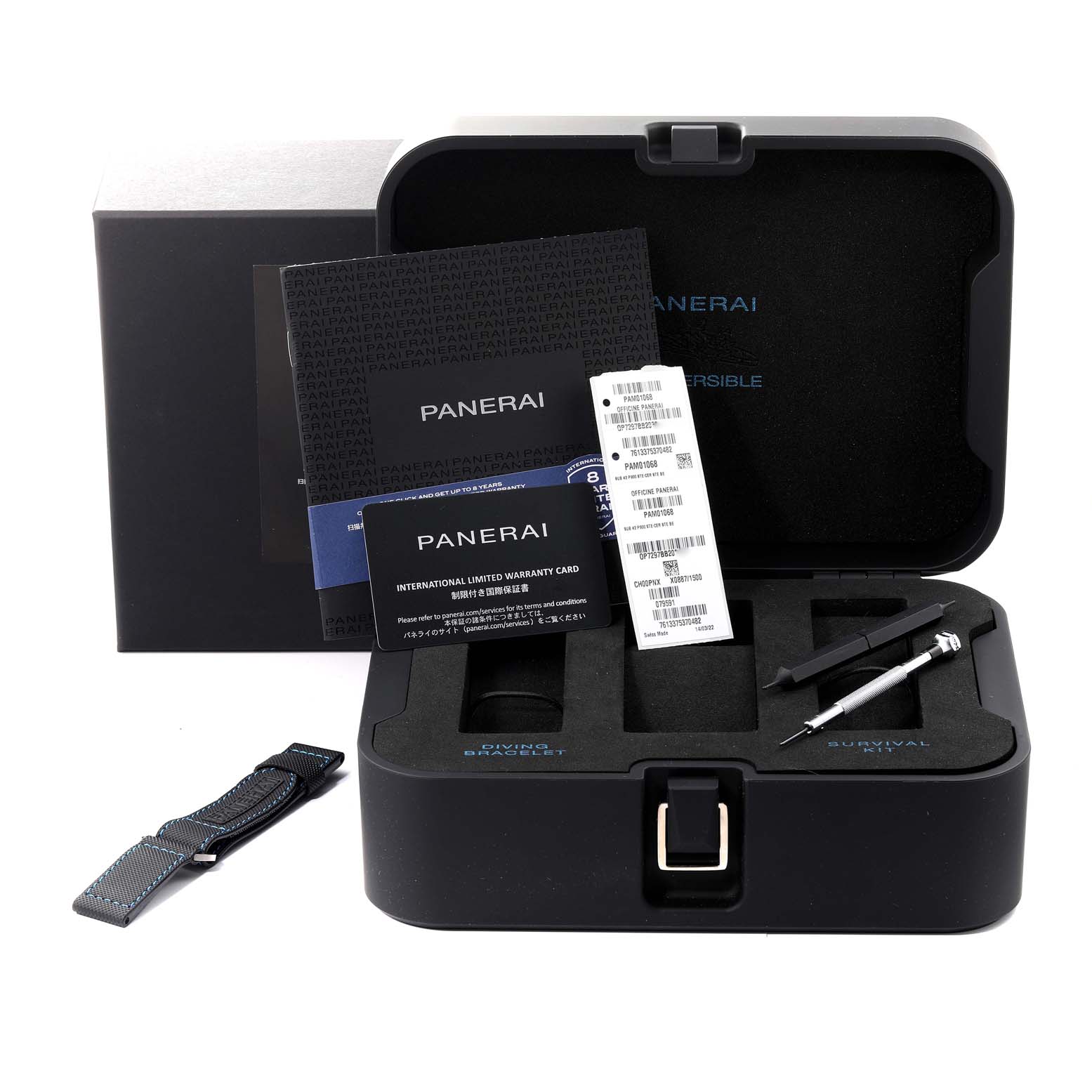 This image shows the packaging and accessories for a Panerai Submersible PAM01068 Men's Stainless Steel Blue Dial PAM01068 Men's Stainless Steel Blue Dial watch, including paperwork, a strap, and tools.