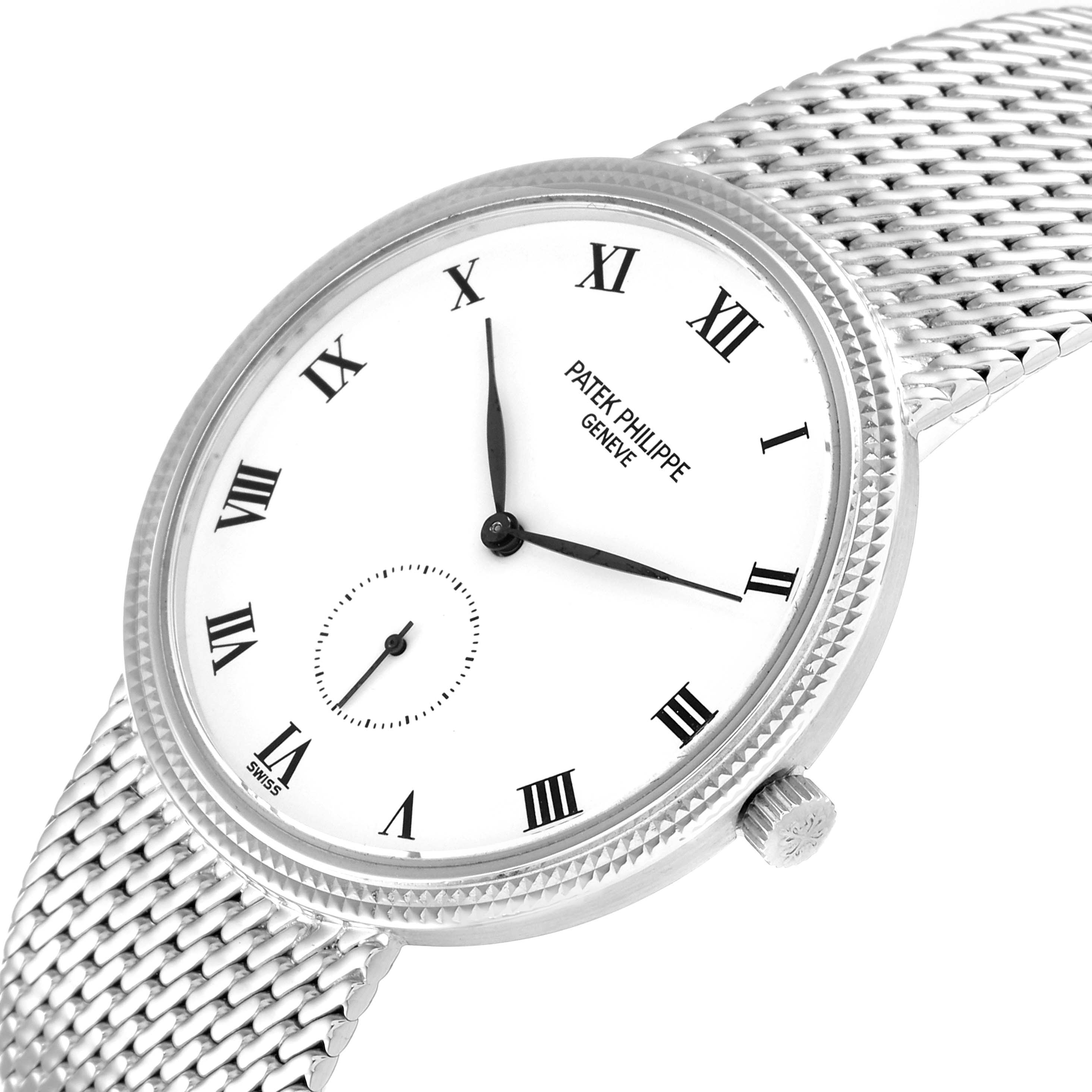 The image shows a Patek Philippe Calatrava 3919G Men's White Gold White Dial 3919G Men's White Gold White Dial watch at an angled view, highlighting its face, Roman numerals, and silver mesh strap.