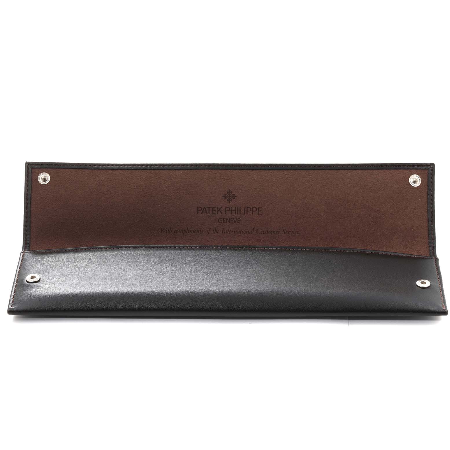 This image shows an open leather case for the Patek Philippe Calatrava 5119G Men
s White Gold White Dial 5119G Men
s White Gold White Dial watch, displaying its snap-button closure.