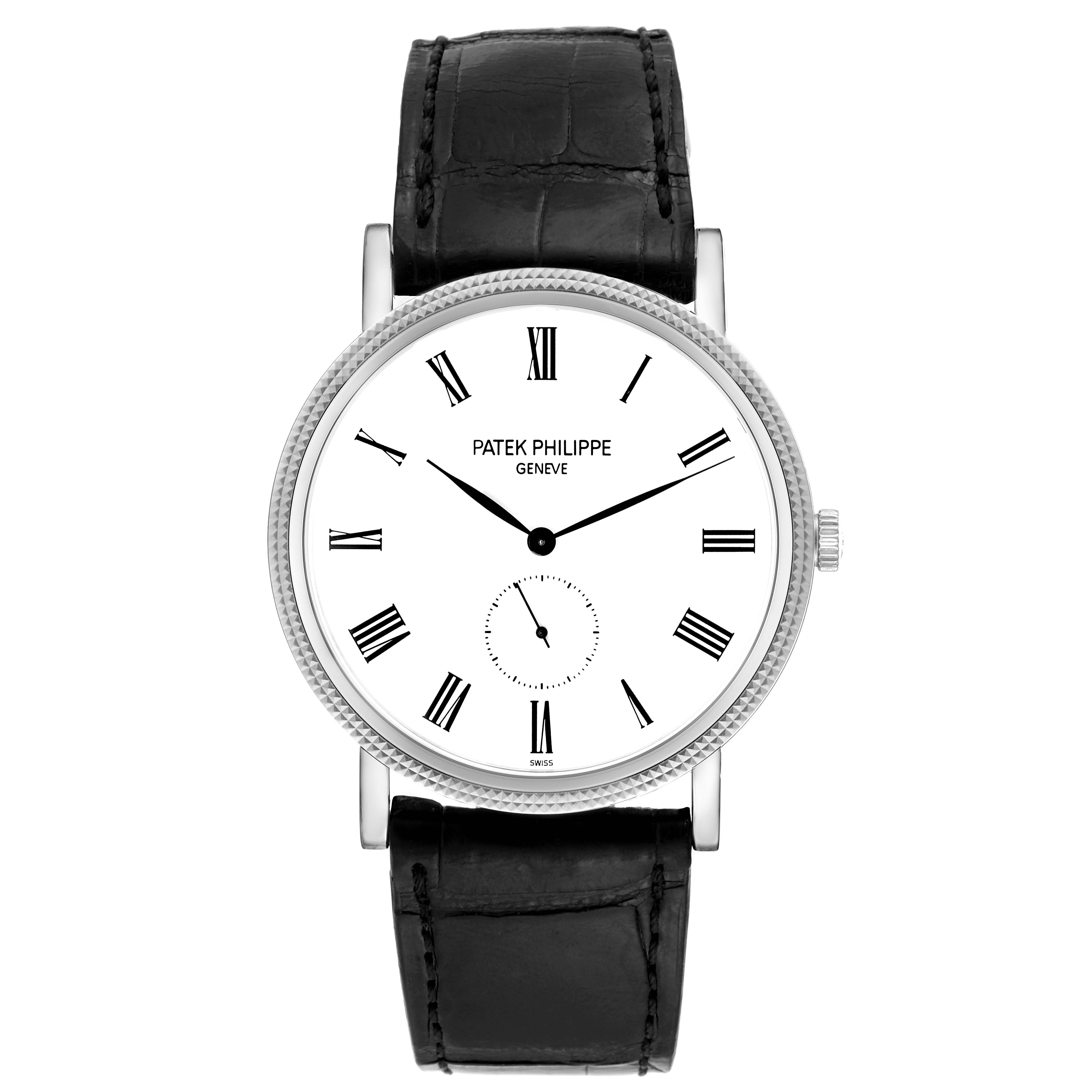 This Patek Philippe Calatrava 5119G Men
s White Gold White Dial 5119G Men
s White Gold White Dial watch is shown from a front angle, displaying its face, Roman numeral markers, hands, and leather strap.