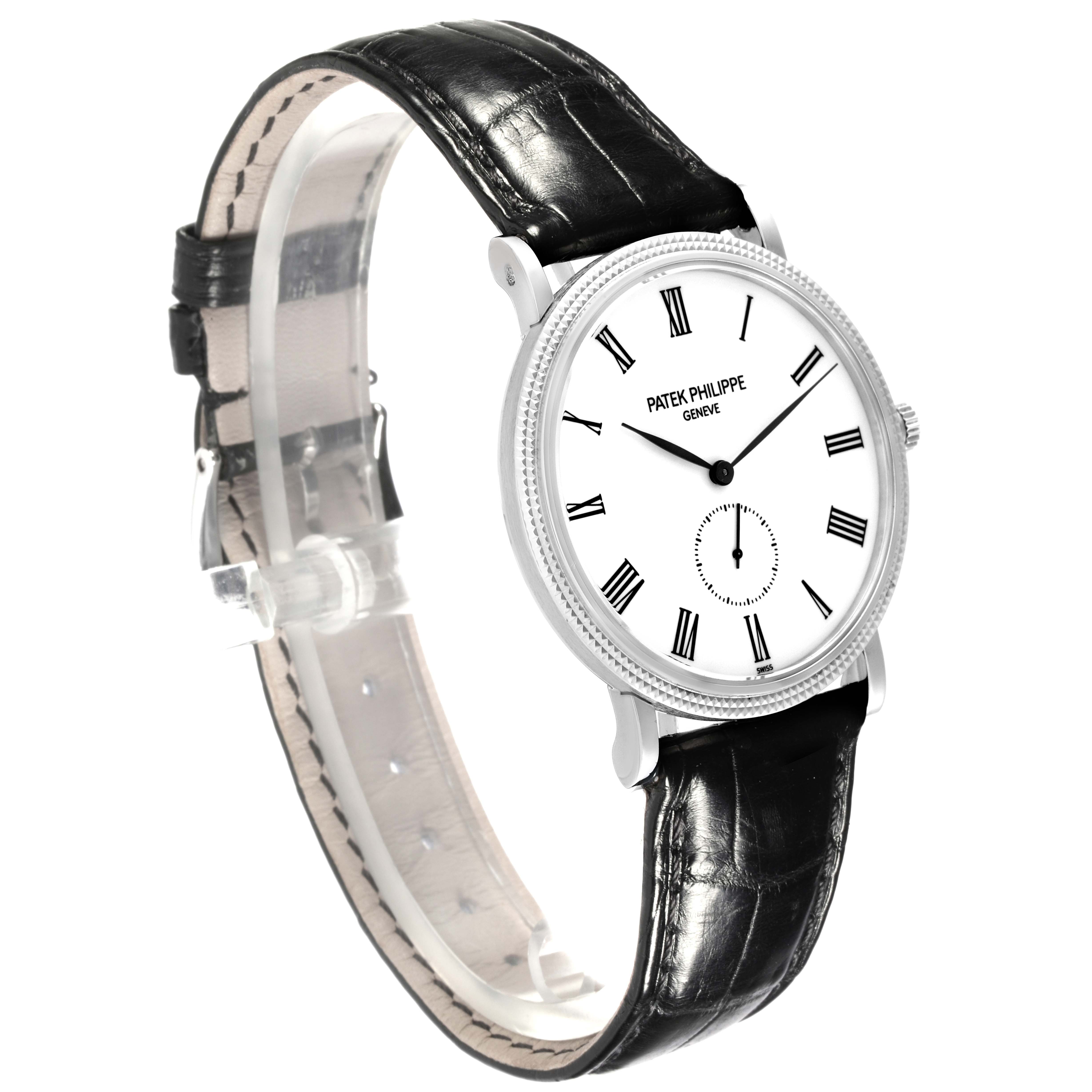 The Patek Philippe Calatrava 5119G-001 Men's White Gold White Dial 5119G-001 Men's White Gold White Dial watch is shown from a side angle, displaying its black leather strap and minimalist white dial.