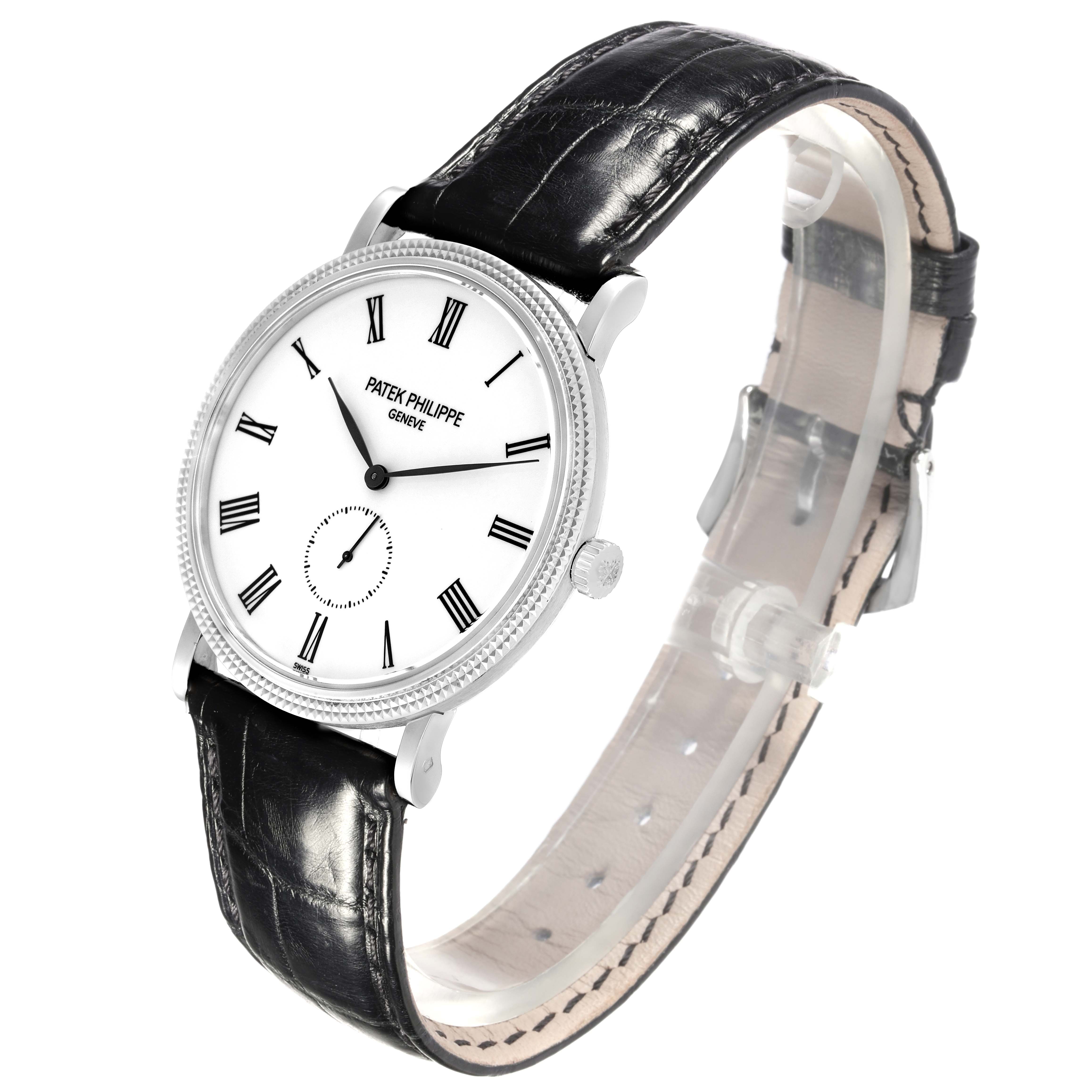 The Patek Philippe Calatrava 5119G-001 Men's White Gold White Dial 5119G-001 Men's White Gold White Dial watch is shown at an angled view, displaying the face, crown, and leather strap.