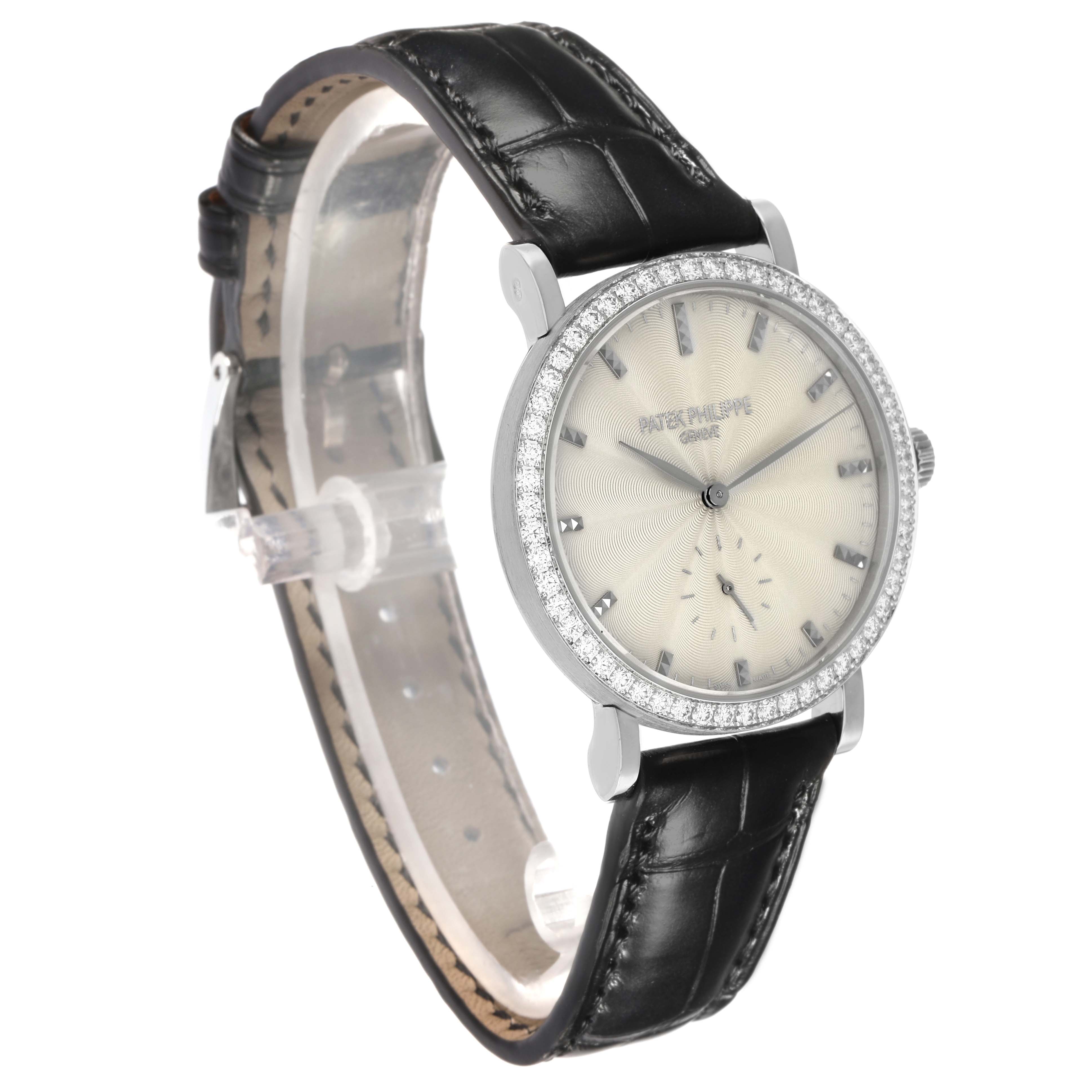 The Patek Philippe Calatrava 7120G-001 Women
s White Gold Beige Dial watch is shown at a slight angle, highlighting the face, bezel, and black leather strap.