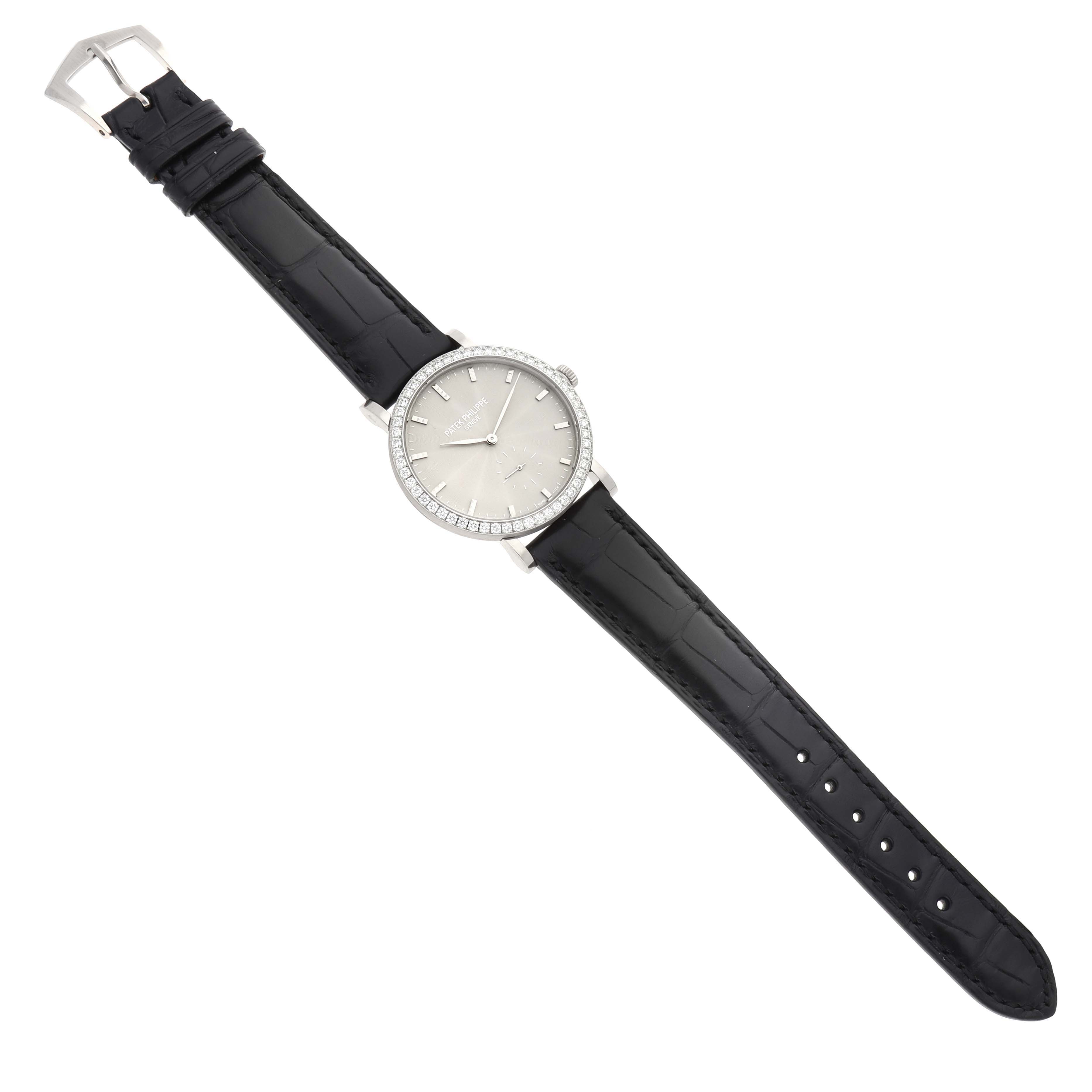 The Patek Philippe Calatrava 7120G-001 Women
s White Gold Beige Dial watch is shown from a top view, displaying the face, bezel, strap, and buckle.