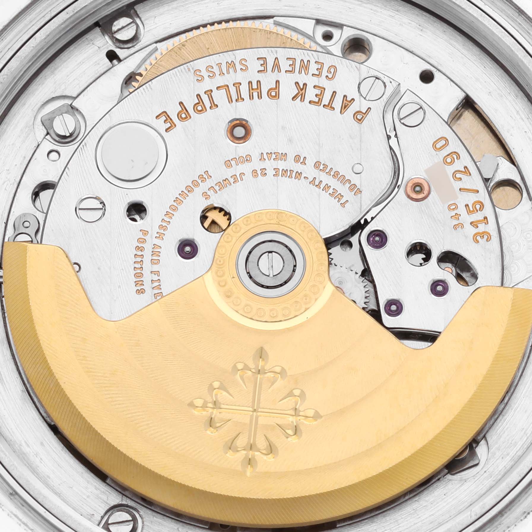 The image shows the movement of the Patek Philippe Calatrava 5108G-010 Men's White Gold Black Dial 5108G-010 Men's White Gold Black Dial watch, highlighting the rotor and intricate mechanics.