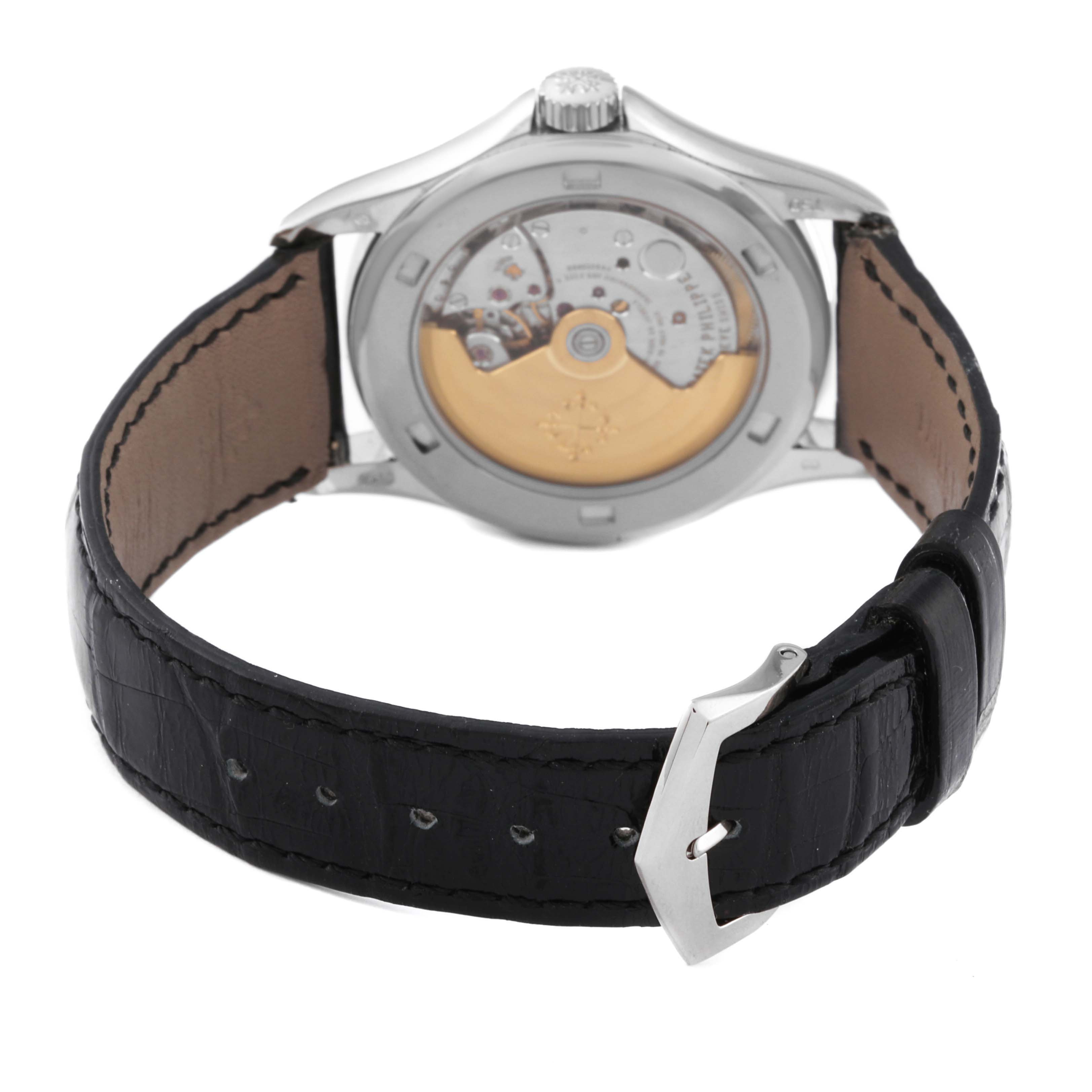 The image shows the back case of the Patek Philippe Calatrava 5108G-010 Men's White Gold Black Dial 5108G-010 Men's White Gold Black Dial watch, highlighting its movement and strap.