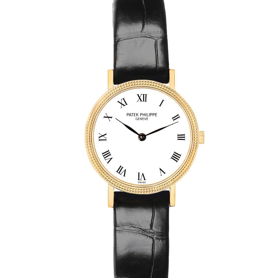 The Patek Philippe Calatrava 4819J Women's Yellow Gold White Dial watch is shown from a top-down angle, highlighting its round gold case, white dial, and black leather strap.
