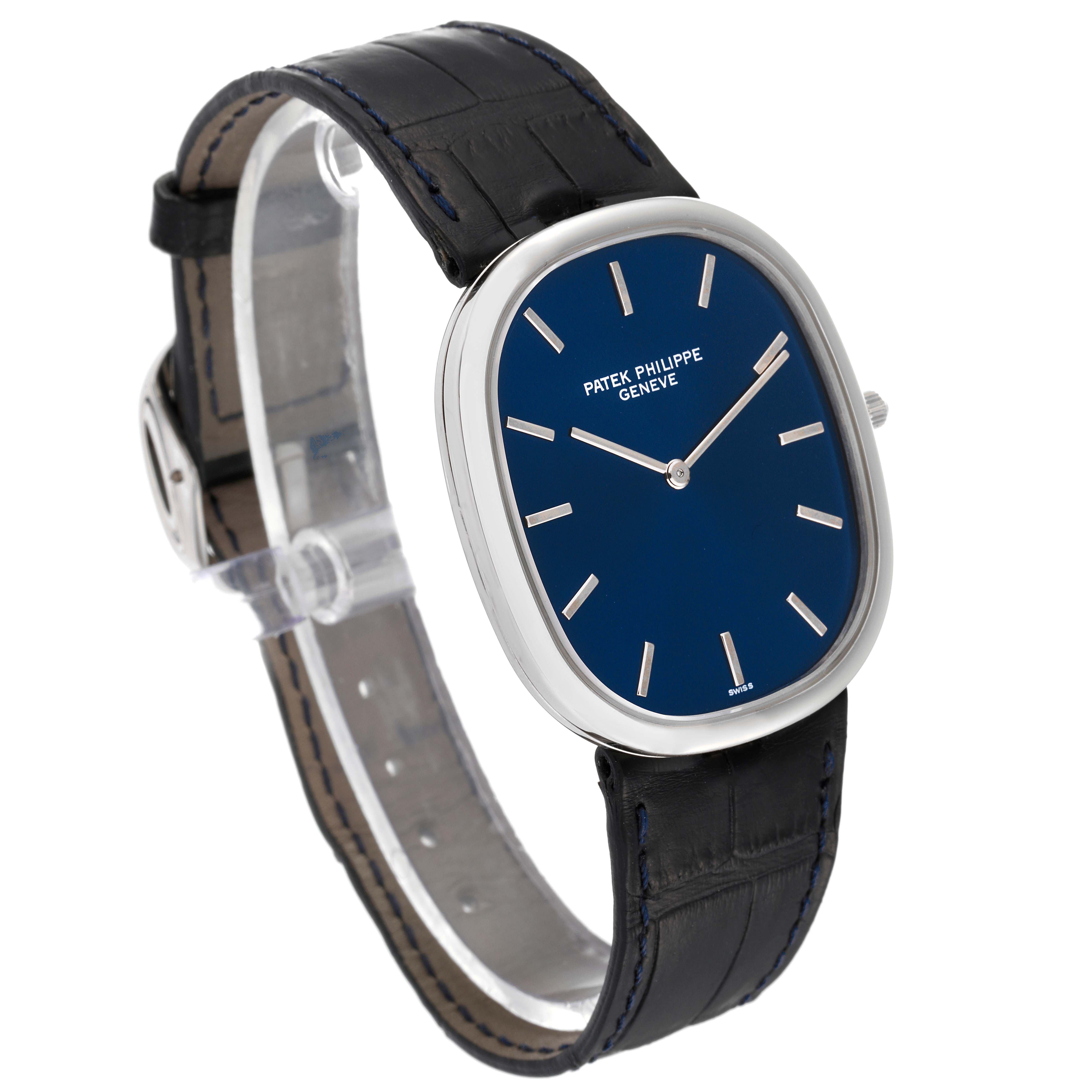 The image shows a side angle of a Patek Philippe Golden Ellipse 5738P-001 Men's Platinum Blue Dial 5738P-001 Men's Platinum Blue Dial watch, showcasing its dial, bezel, and strap.