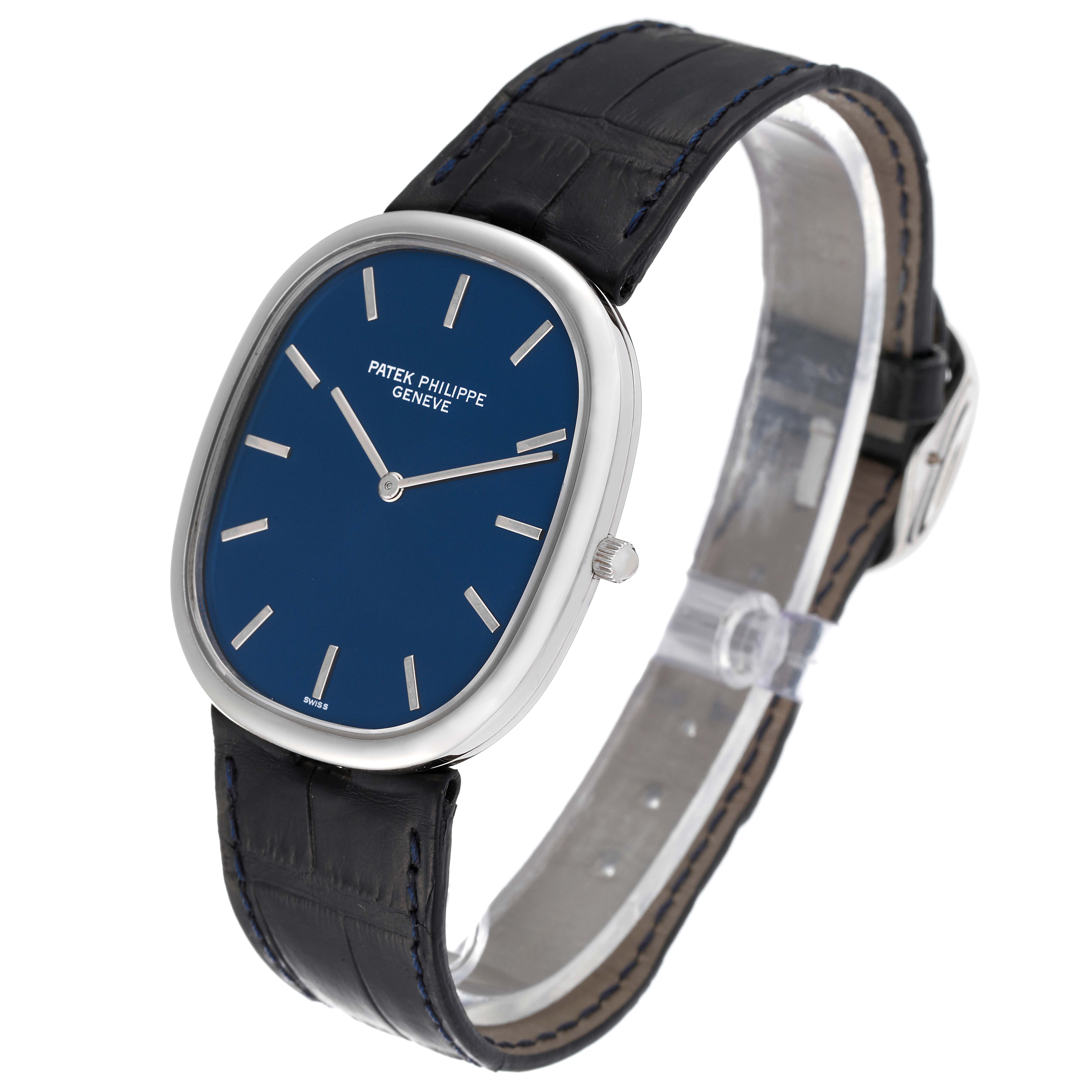 The image shows a Patek Philippe Golden Ellipse 5738P-001 Men's Platinum Blue Dial 5738P-001 Men's Platinum Blue Dial watch, angled to display the face, case, crown, and strap.